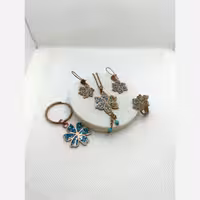 نیم ست گردنبندگوشواره انگشتردستبندآویزکلیدمس فیروزه کوبی گل