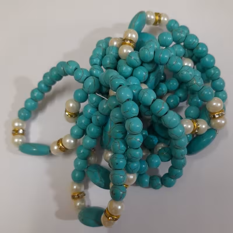 دستبند مروارید رول کش فیروزه(طرح حکاکی) 