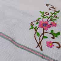 حوله دستبافت طرح گل صورتی