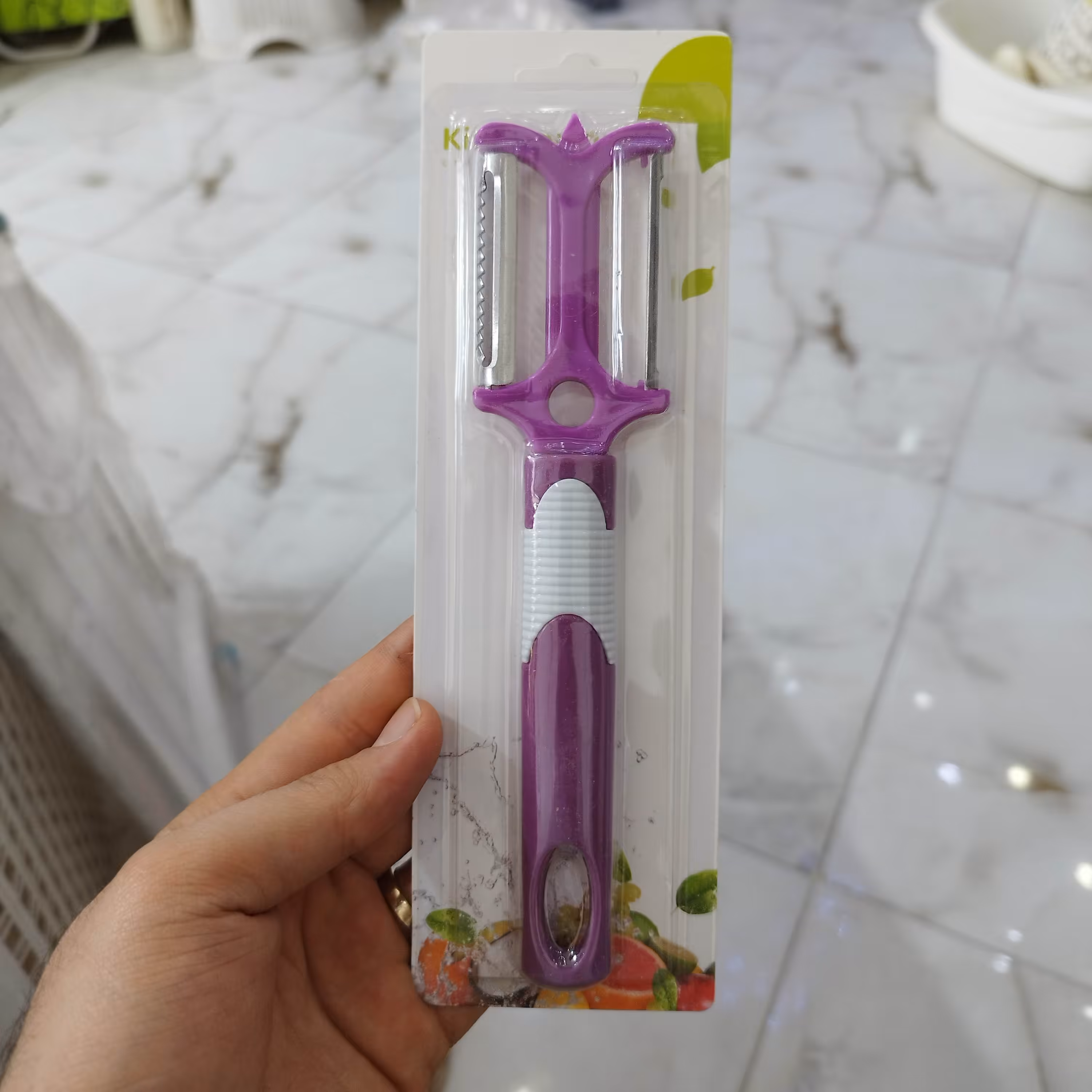 پوست کن دوطرفه و دوکاره در دو رنگ بنفش و نارنجی