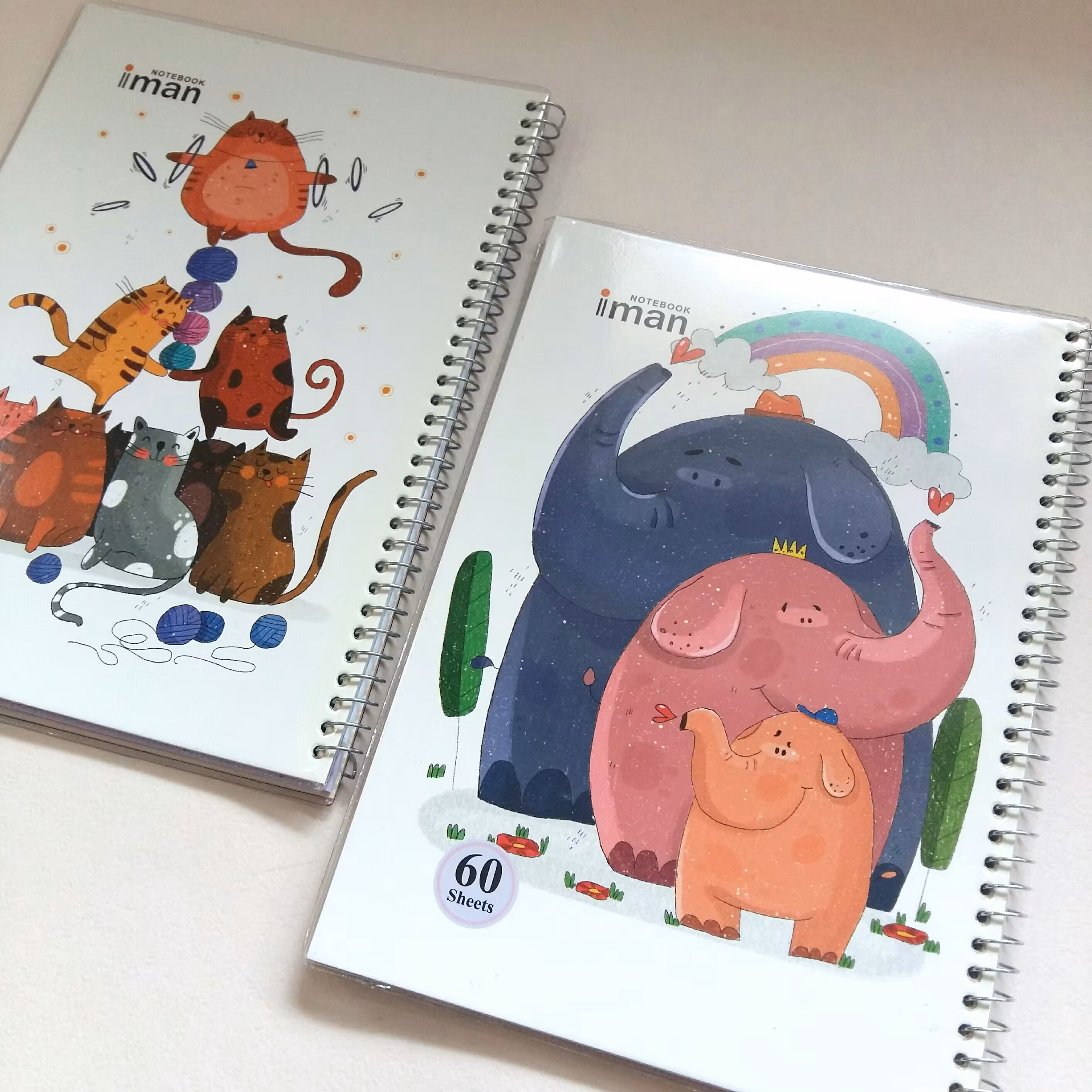 دفتر 60 برگ گربه و فیل سیمی فنری مجلد حاشیه دار خط دار  فانتزی طرح حیوانات کیوت برند ایمان یک عدد