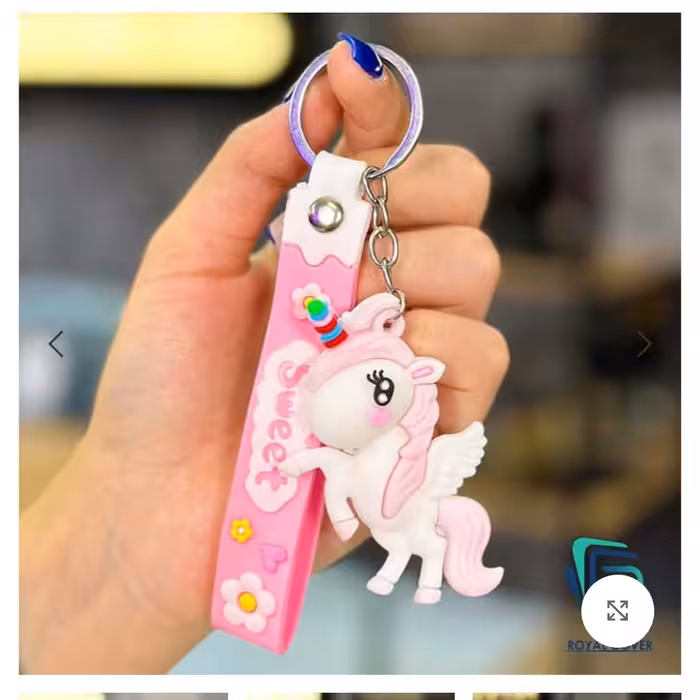 سرکلیدی یونیکورن با آویز سیلیکونی رنگ صورتی و بنفش موجوده لوازم تحریر کلاسیک