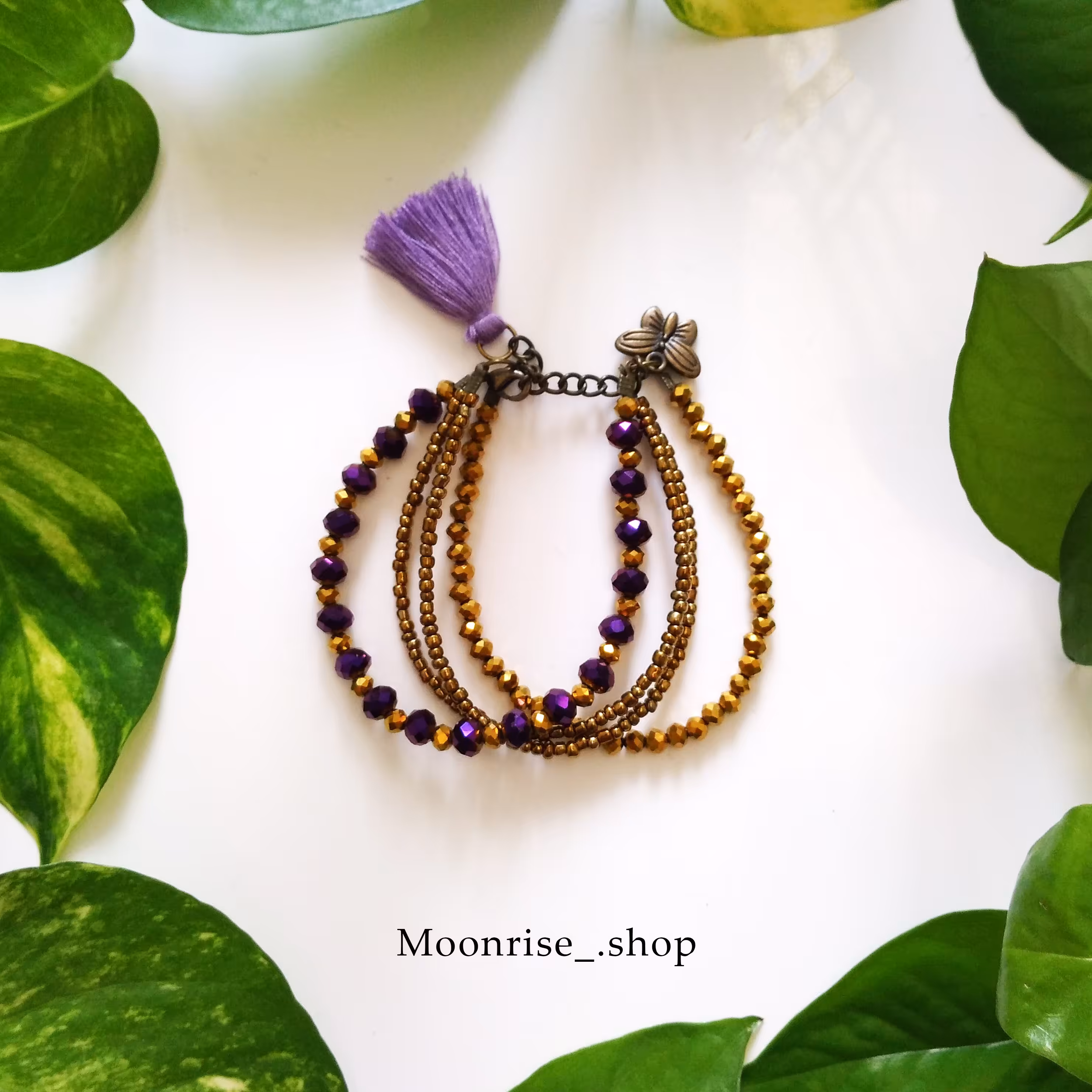 دستبند کریستالی بنفش و طلایی