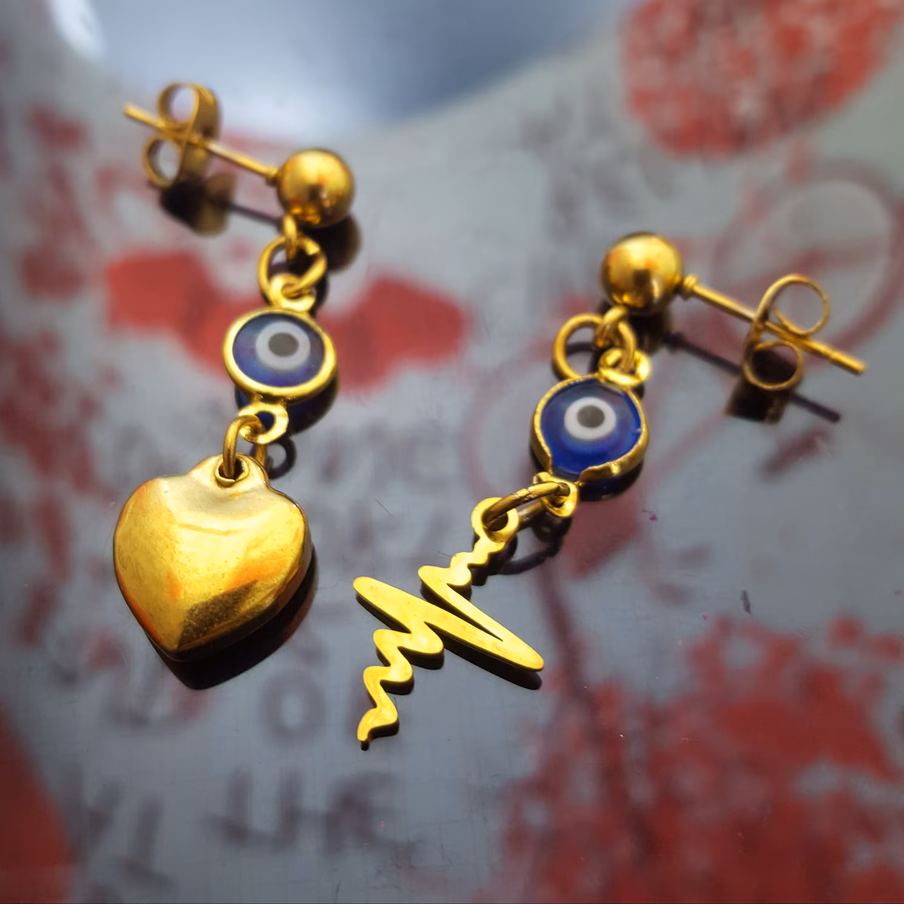 گوشواره میخی تا به تا چشم نظر وقلب محدب ظربان استیل ضد حساسیت روکش طلا 407