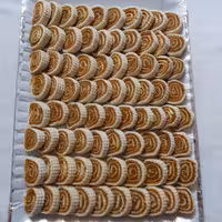 حلواسنتی زعفرونی رولتی یک کیلوگرمی  هزینه ارسال  با مشتری و یا تحویل حضوری