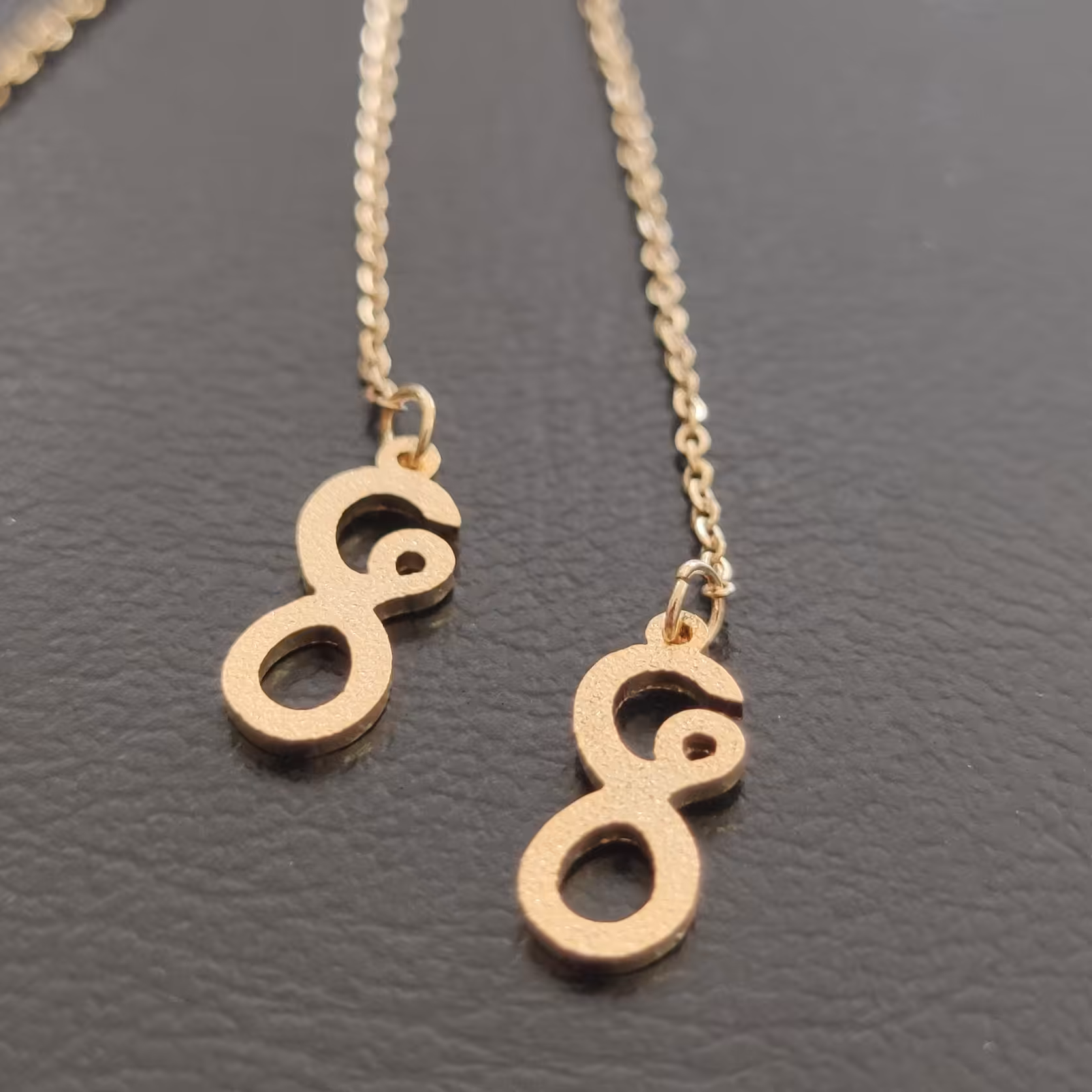 گوشواره بخیه ای مدل بی نهایت