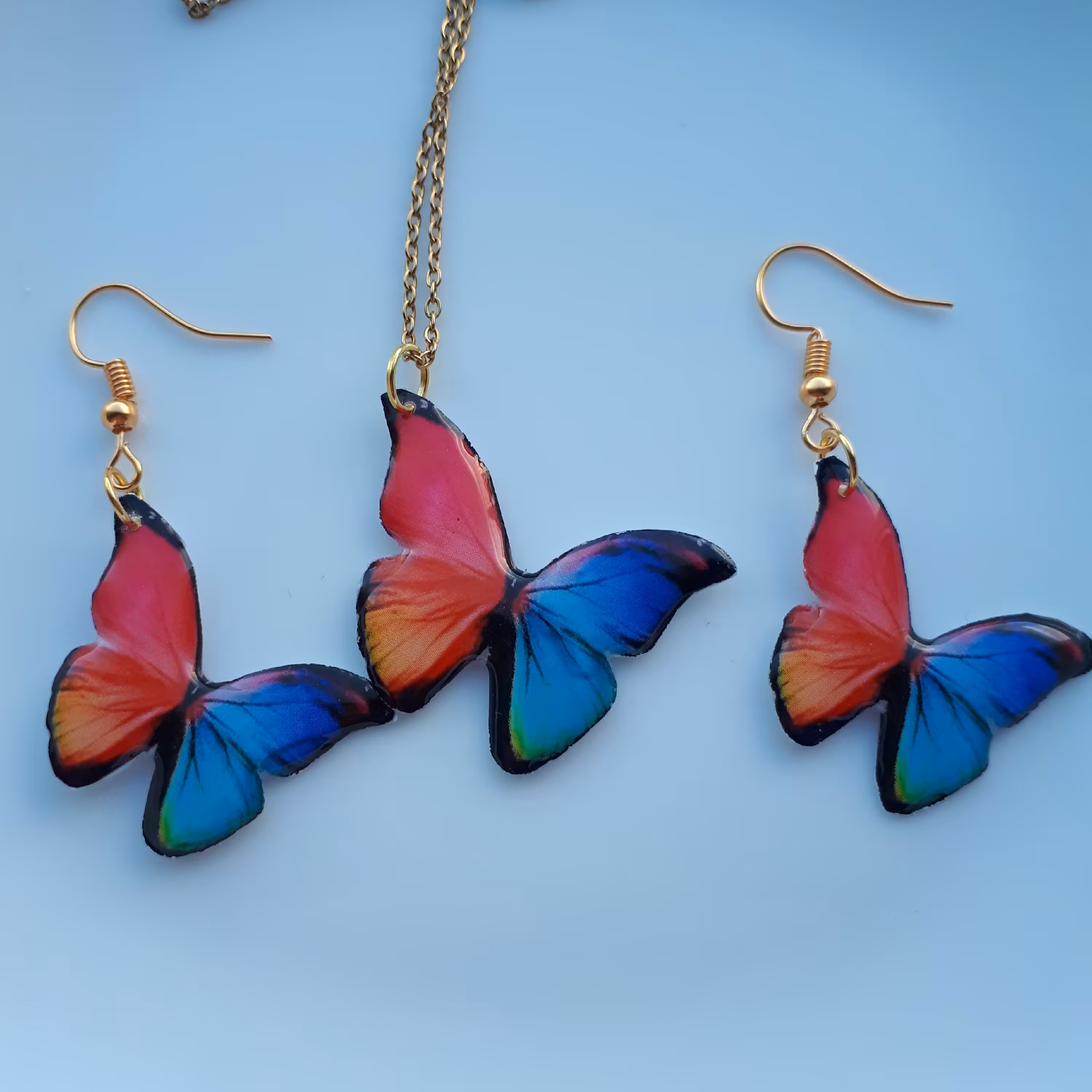 گردنبند و گوشواره پروانه رزینی اتصالات استیل رنگ ثابت