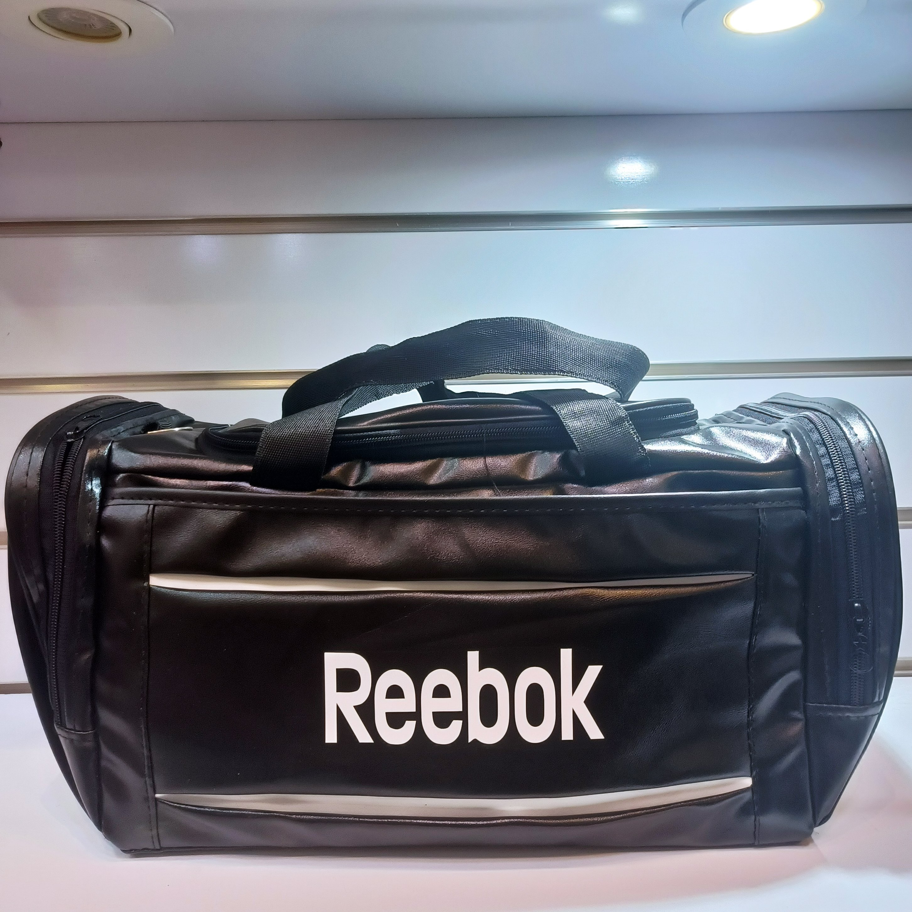 سام ورزشی بزرگ دخترانه پسرانه در رنگ های مشکی آبی زرد قرمز