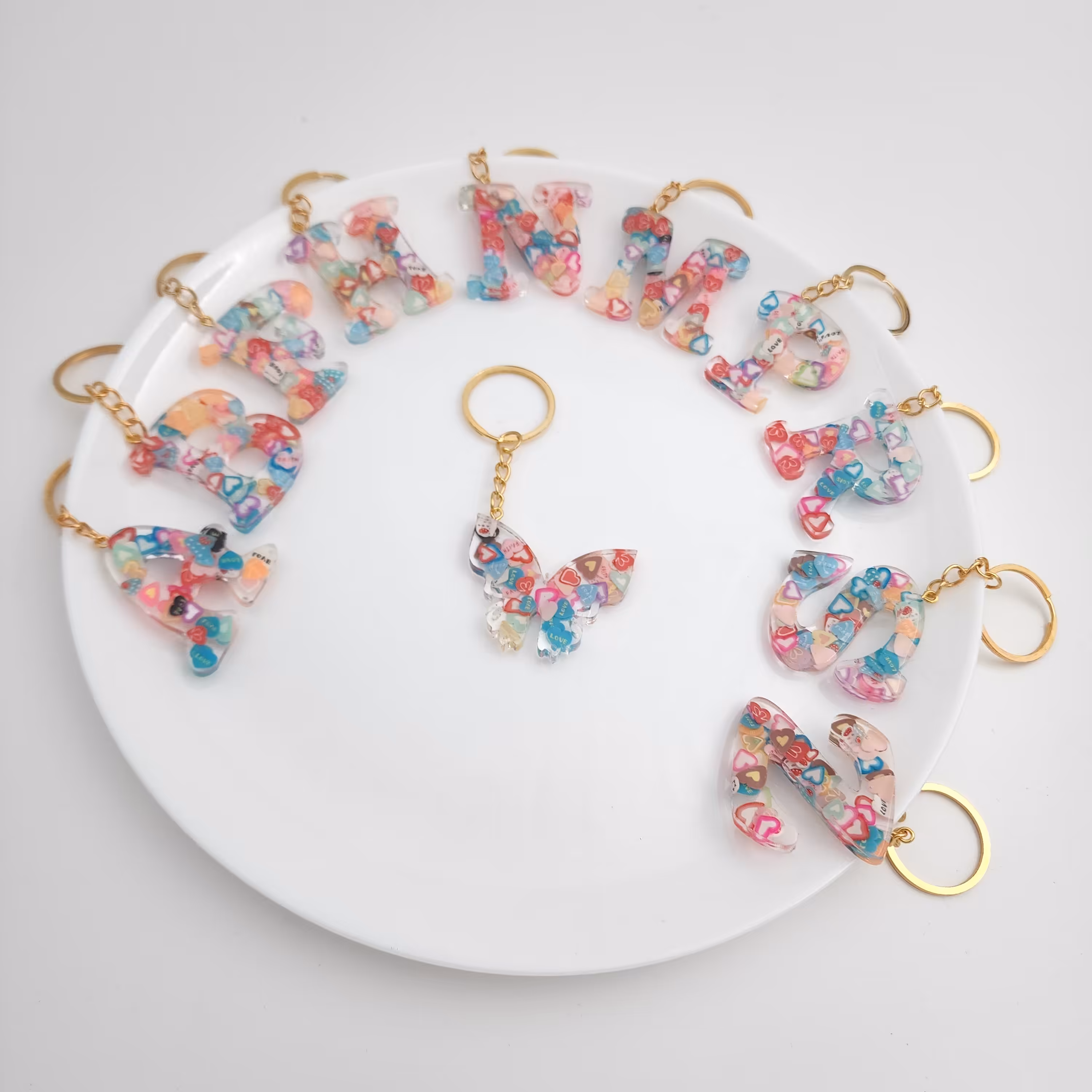 پک 18 عددی جاکلیدی رزینی مدل قلبی ( جاسوییچی ) ( آویز ) عمده