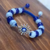 دستبند چشم نظر گره کشویی مهره های سنگی رنگ ثابت