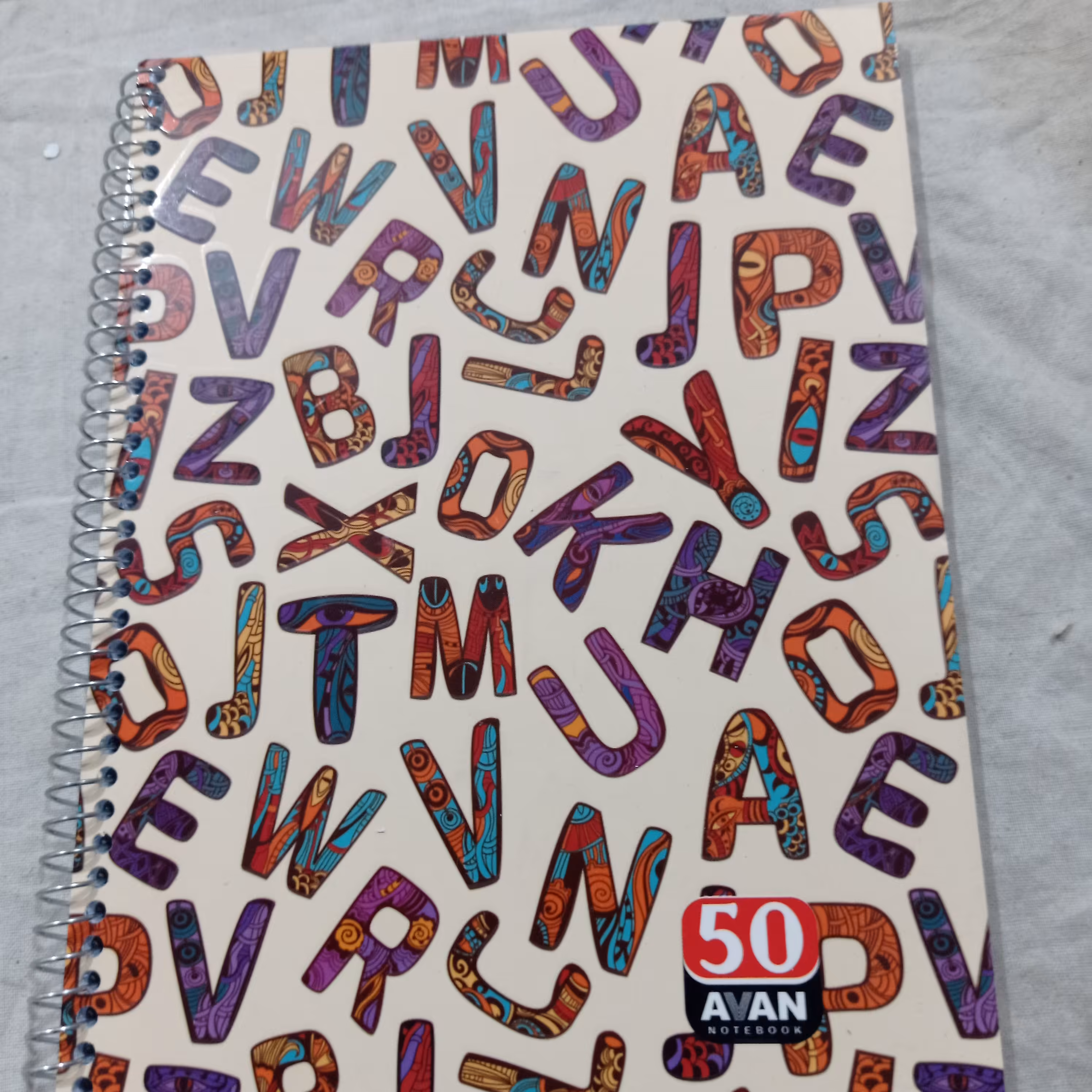 دفتر زبان فنری 50برگ 4خط جنس خوب مارک آوان