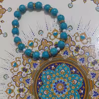 دستبند با مهره های فیروزه ای و مروارید و خرج کار طلایی