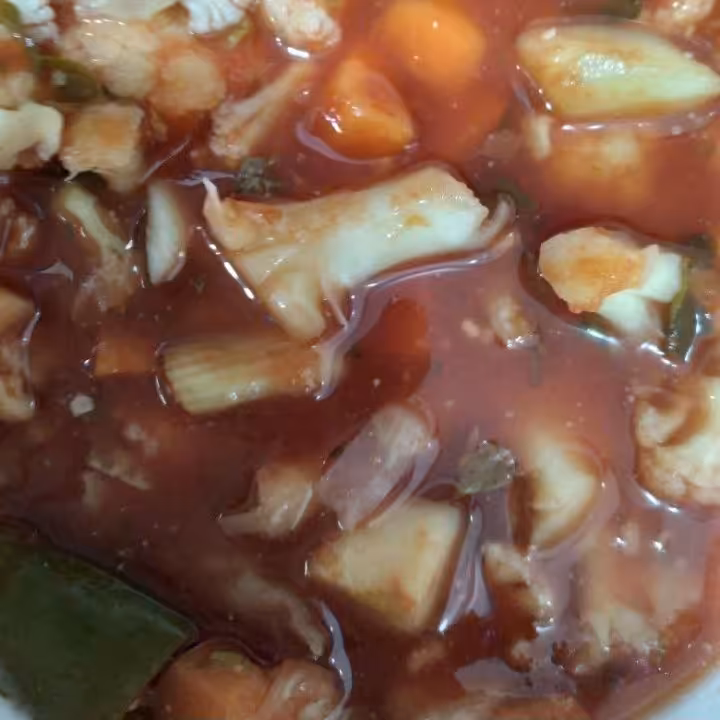 ترشی گوجه ای مشهدی پرملات در بسته بندیهای نیم کیلوگرمی