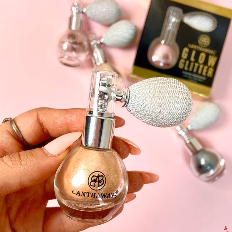 شیمر و هایلایتر  پمپی شاین کننده مایع صورتی و مسی . صورت و بدن .