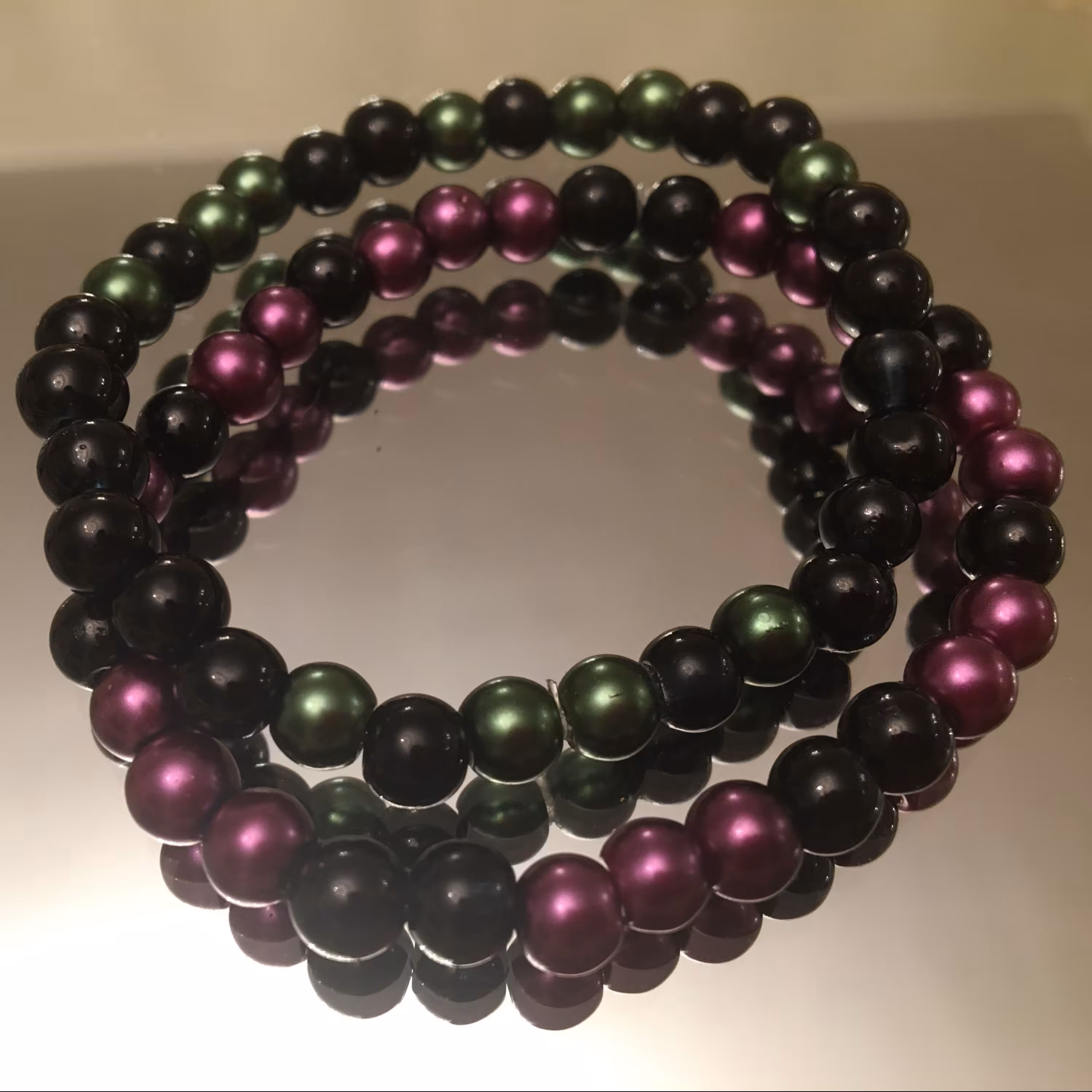 ست دستبند دوتایی دستساز مروارید سیاه و بنفش