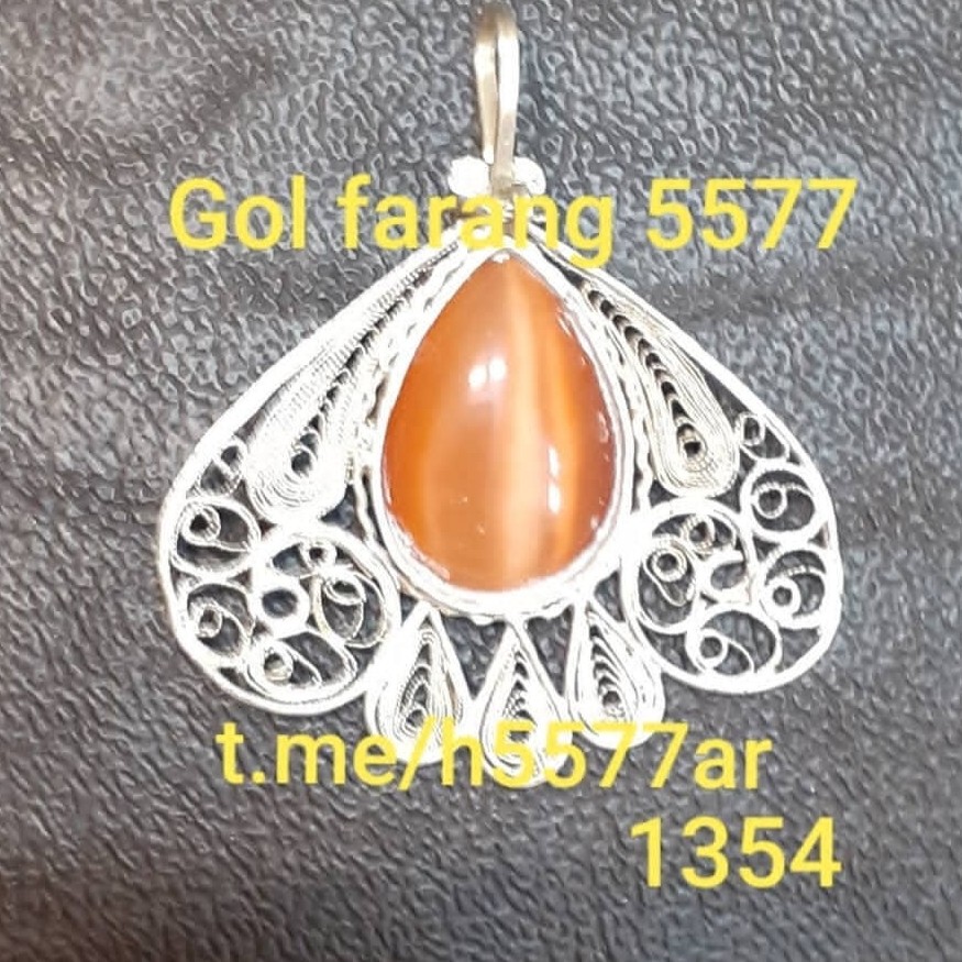 گردن آویز ملیله،نام اثر شبنم،نگین چشم ببری،وزن خالص4.5 گرم بدون نگین،ابعاد3.5در3.5 ،آبکاری شده با رادیوم،جنس نقره خالص