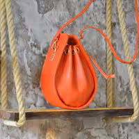 کیف دوشی چرم طبیعی دخترانه نارنجی خاص و هنری کوچک 