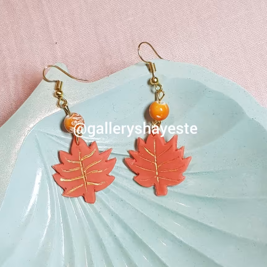 گوشواره پلیمری برگ پاییزی نارنجی مدل گالری شایسته و ماه فام