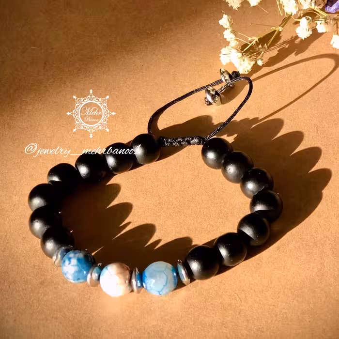 دستبند عقیق 
ساخته شده از عقیق و انیکس