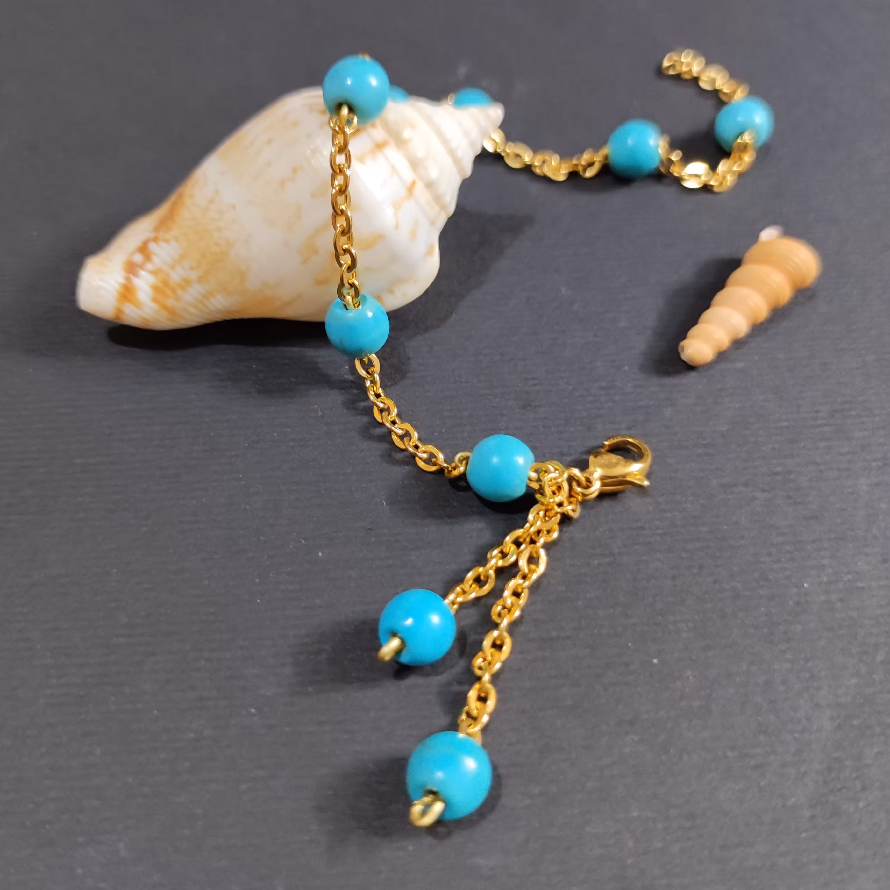 دستبند با زنجیر استیل و مهره فیروزه رنگ ثابت 