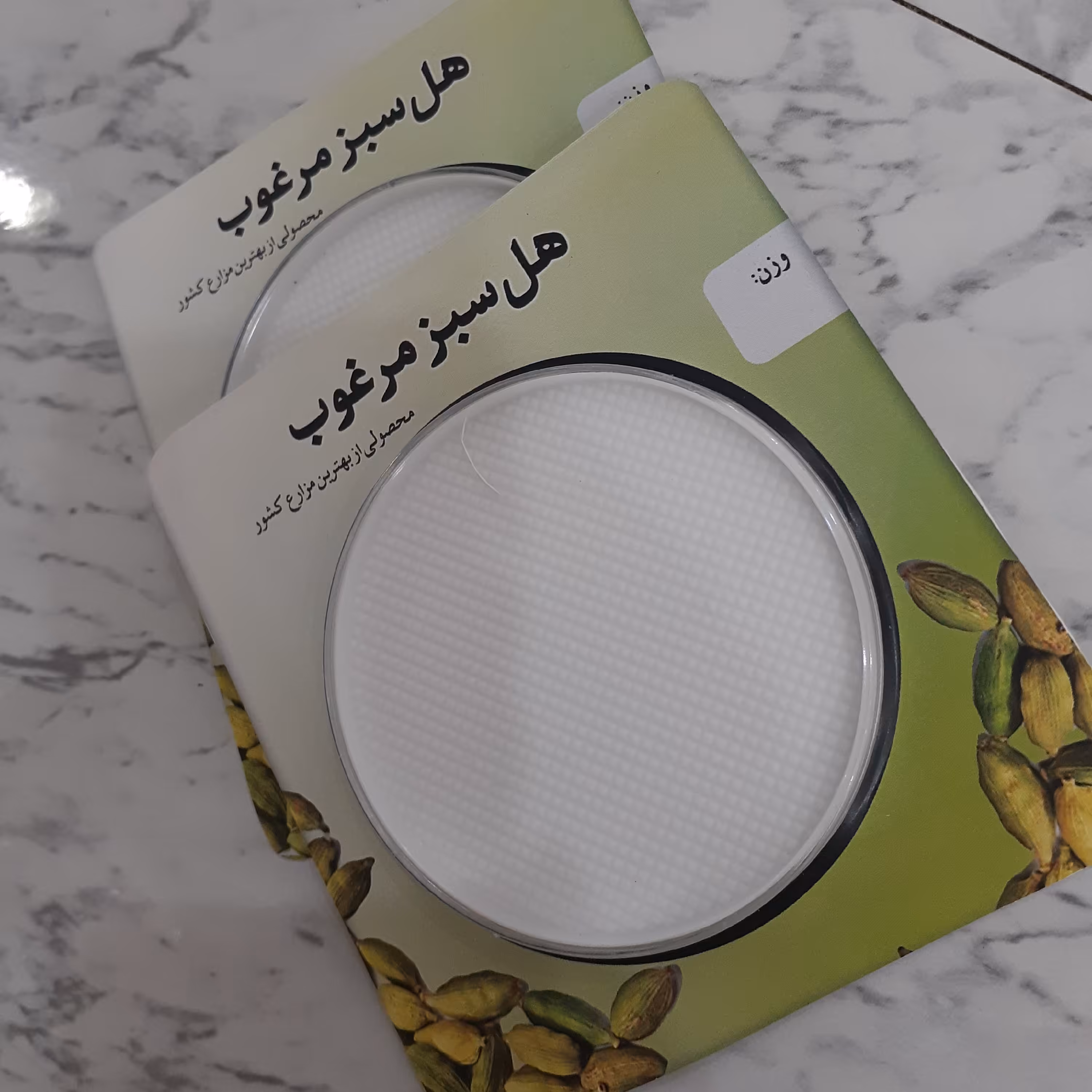 بسته بندی پودر هل با طلق گرد مخصوص یک مثقال  (20 عدد)