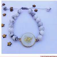 دستبند نماد تولد با سنگ هائولیت و نماد صدفی دور استیل