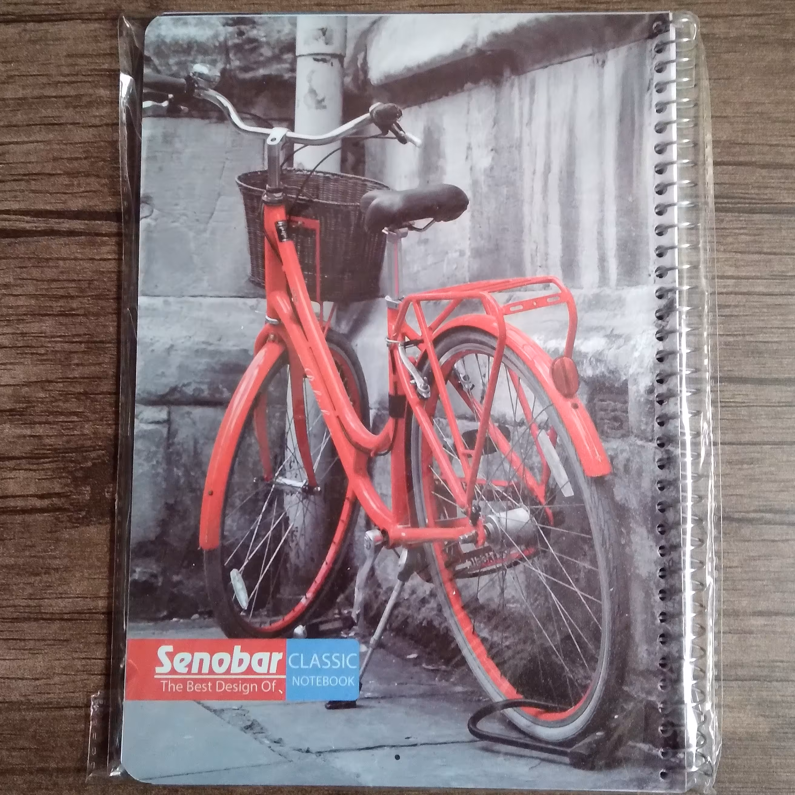 دفتر مشق 100 برگ سیمی صنوبر طرح دوچرخه جلد طلقی