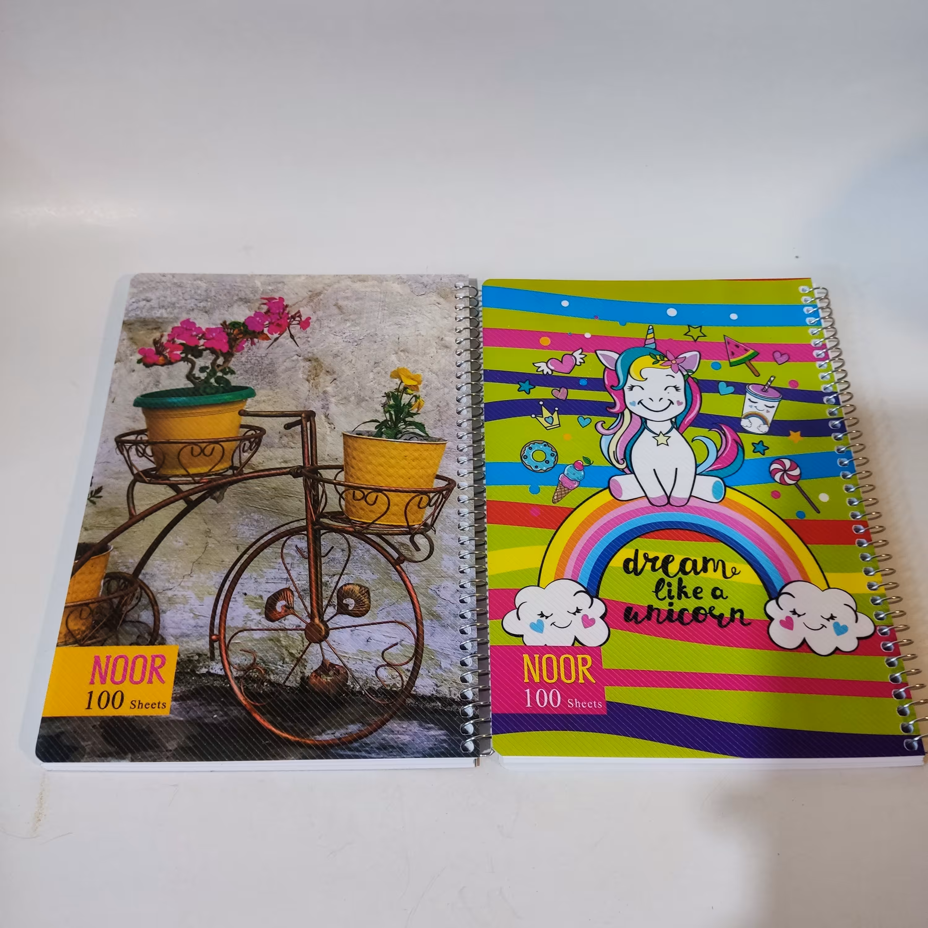 دفتر سیمی 100 برگ در هفت طرح  کلاسیک و کارتونی