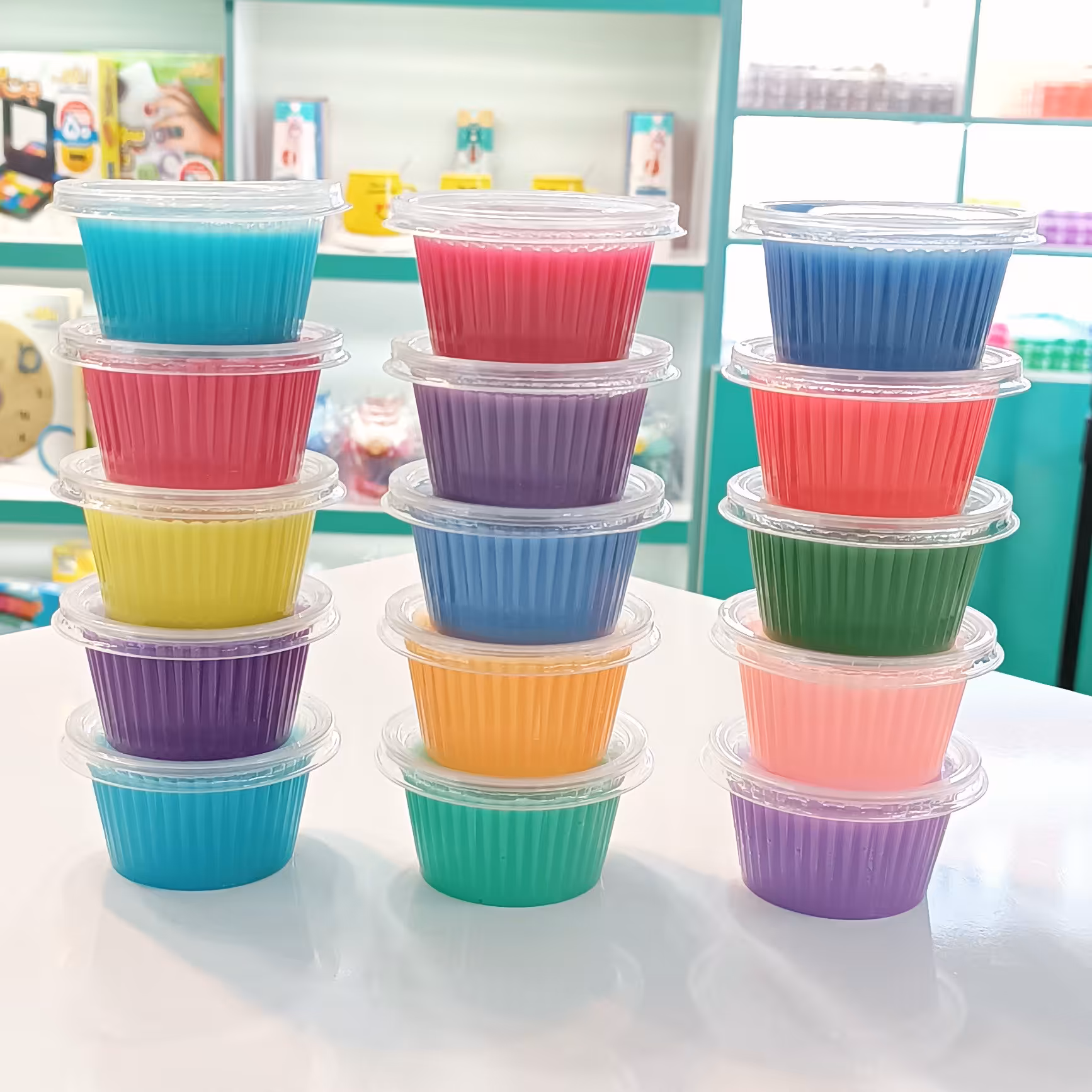 پک اسلایم 15 عددی هر اسلایم 90 گرم در رنگهای متنوع و جذاب پک 15 عددی اسلایم 