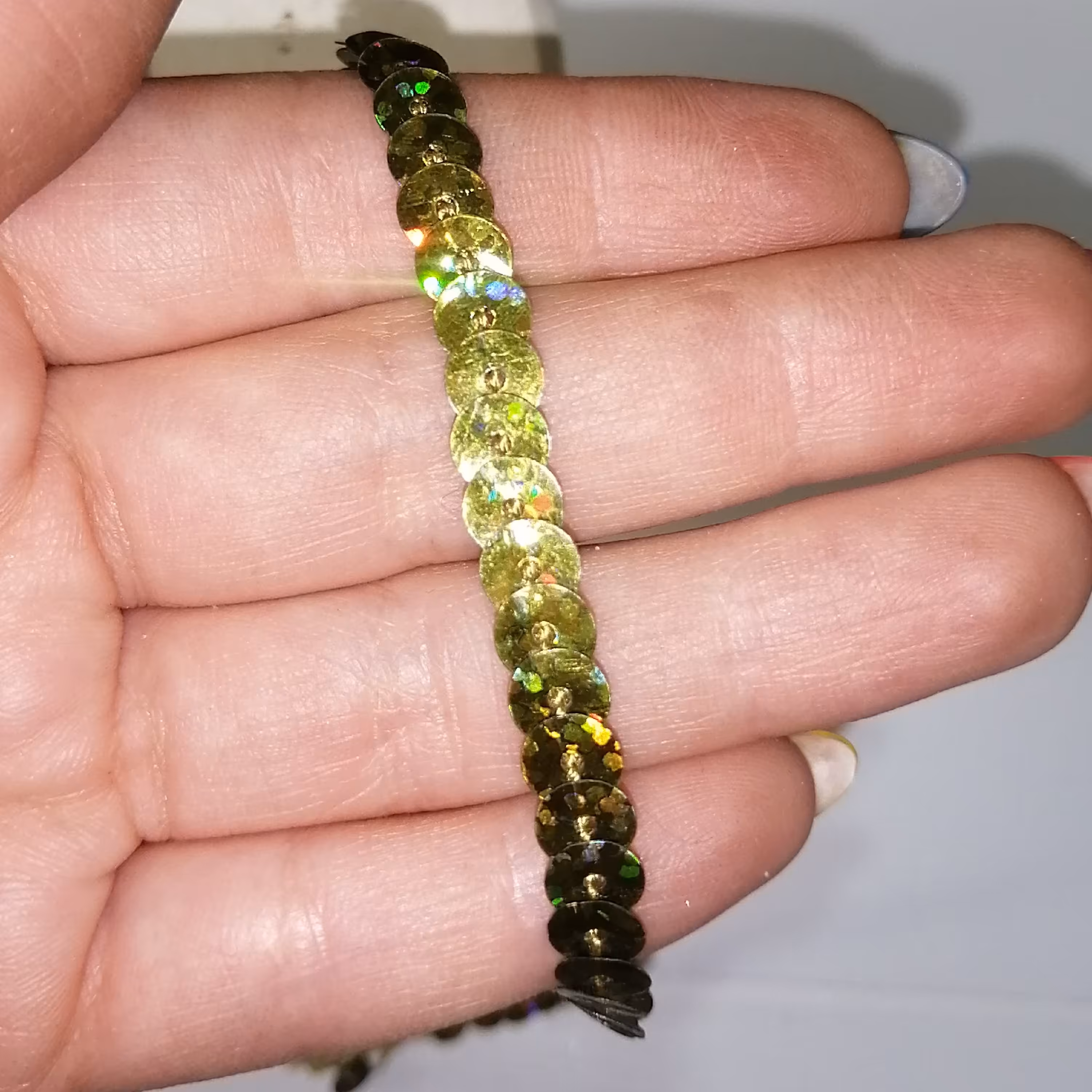 نوار یراق تزئینی لباس  ریسه پولکی  سبز عرض   نیم سانت و طول 1 متر 