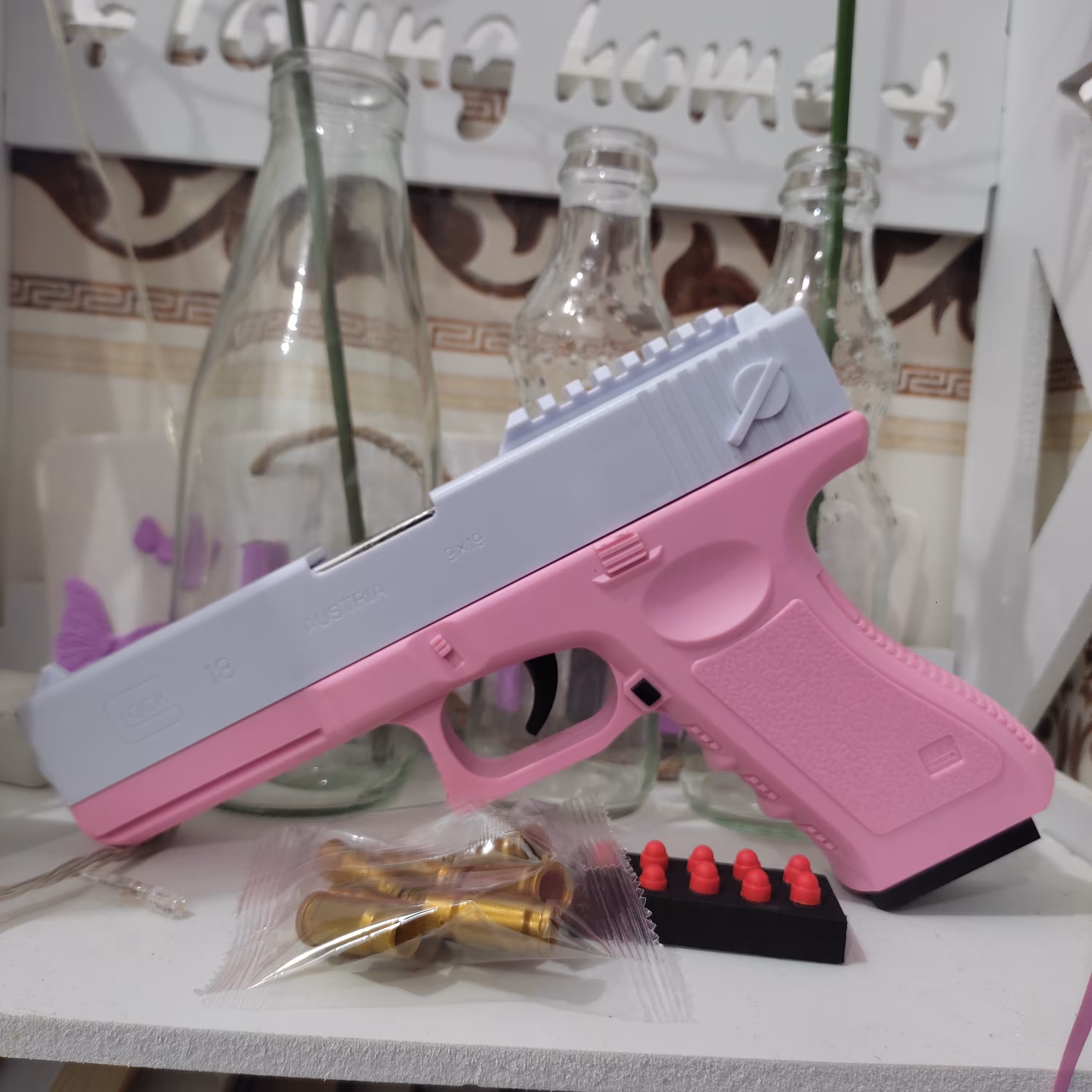 اسباب بازی تفنگ کلت پوکه پران صورتی