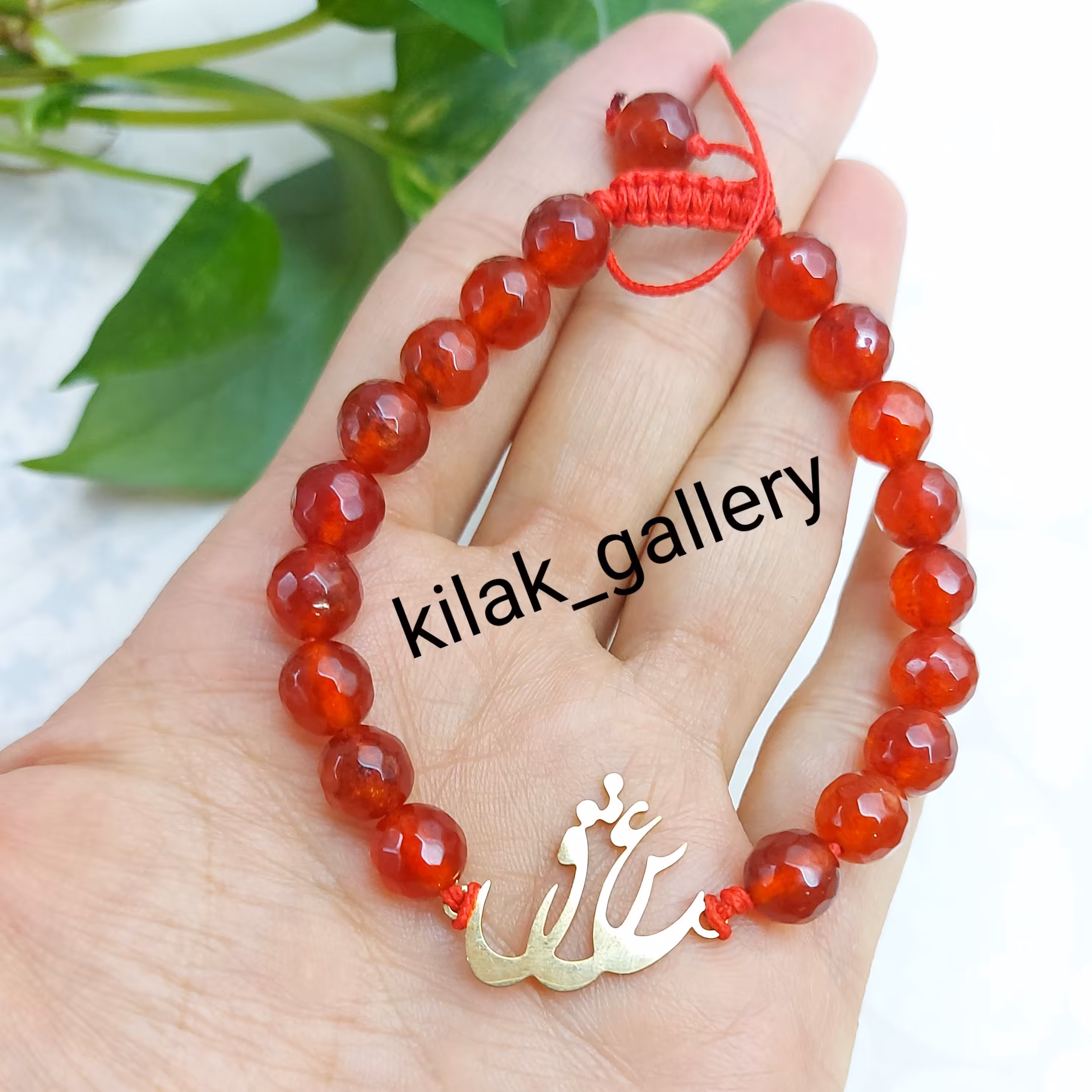 دستبند سنگ مرجان و پلاک استیل عشق با بافت کشویی