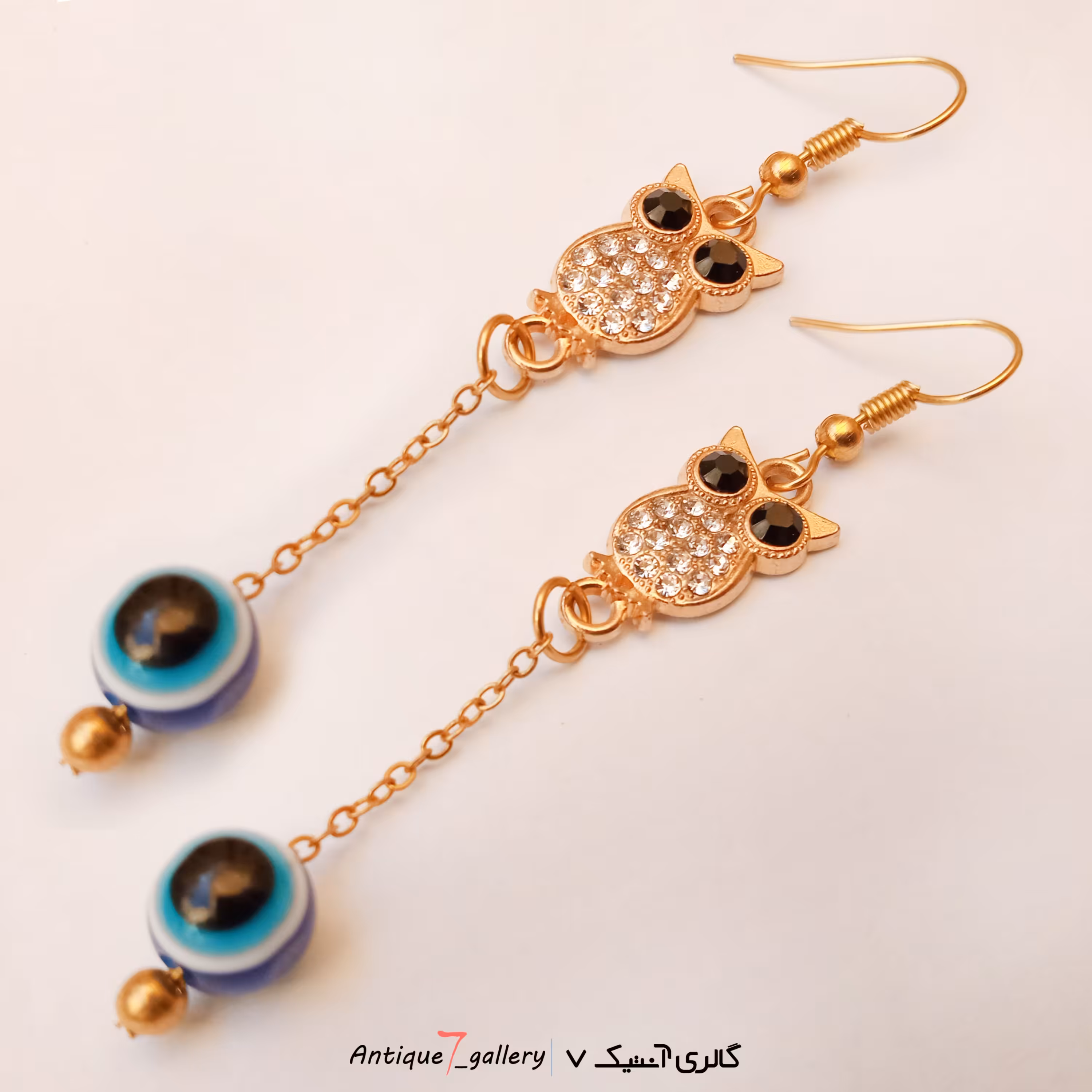 گوشواره رنگ ثابت طلایی طرح جغد زنجیر دار با مهره چشم نظر