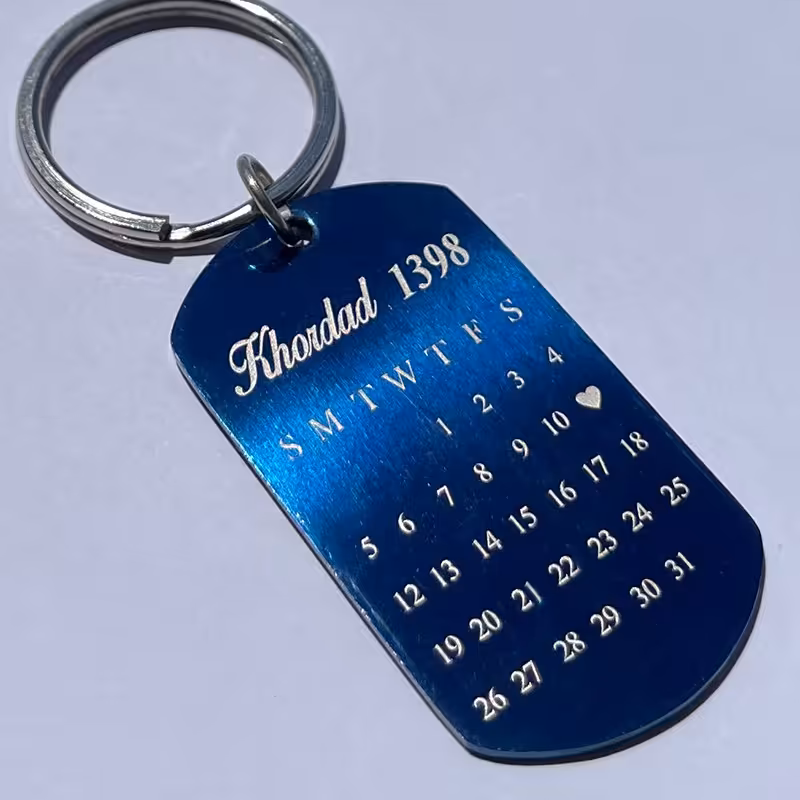 جاسوییچی استیل آبی رنگ تقویم و حک چهره