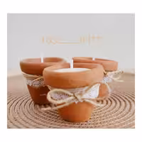 شمع با ظرف سفالی و دیزاین ربان و کنف