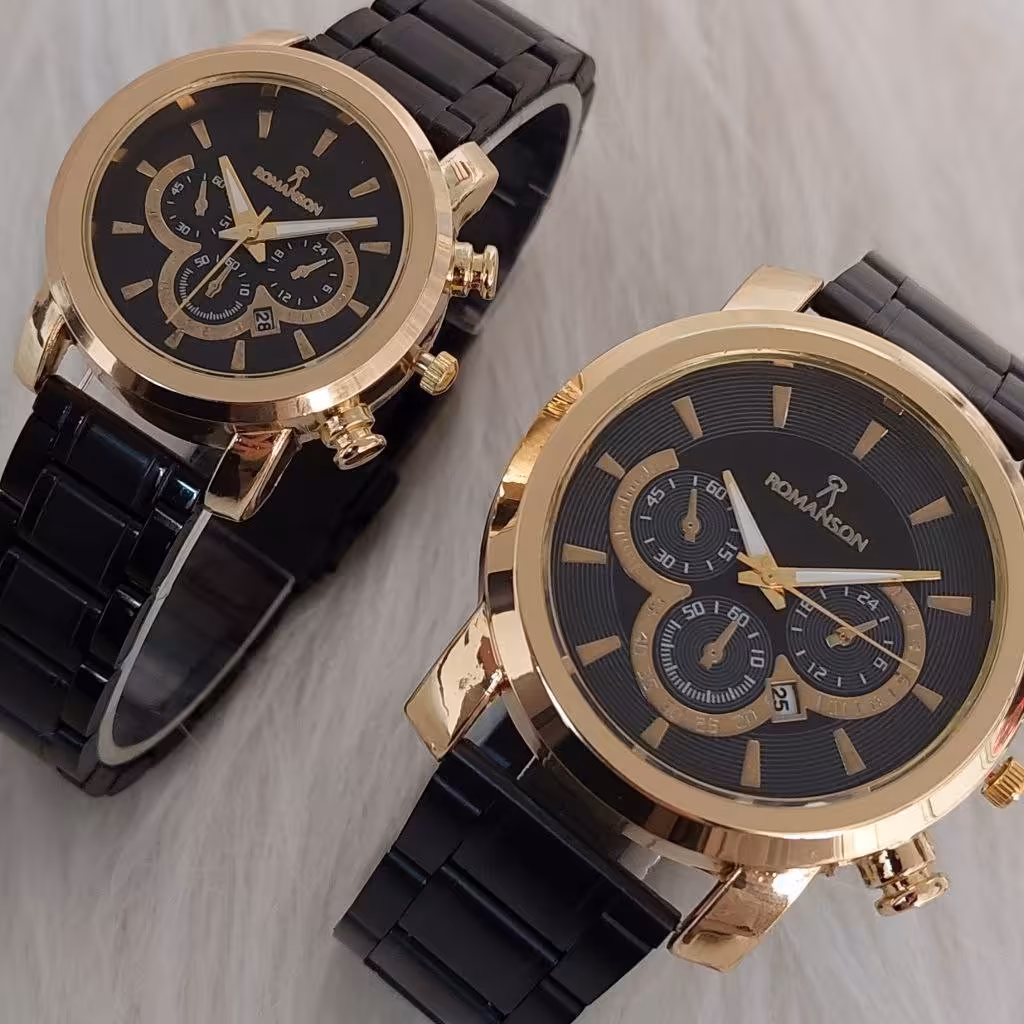 ست ساعت زنانه و مردانه مارک رومانسون بنداستیل مشکی صفحه مشکی قاب طلایی. طرح سه موتوره
