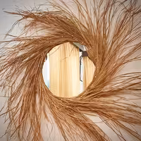 آینه گرد دکوراتیوسبک بوهو کاملا دستساز کار شده با متریال طبیعی و طراحی خاص قطر40سانتیمترباحاشیه80