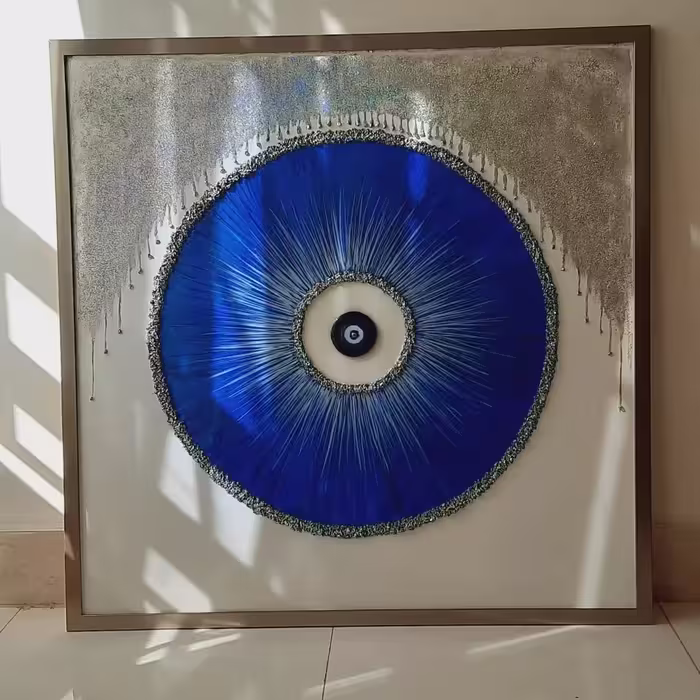 تابلو دکوراتیو چشم نظر  با تم نقره ای و طلایی به همراه قاب سایز 100 در 100