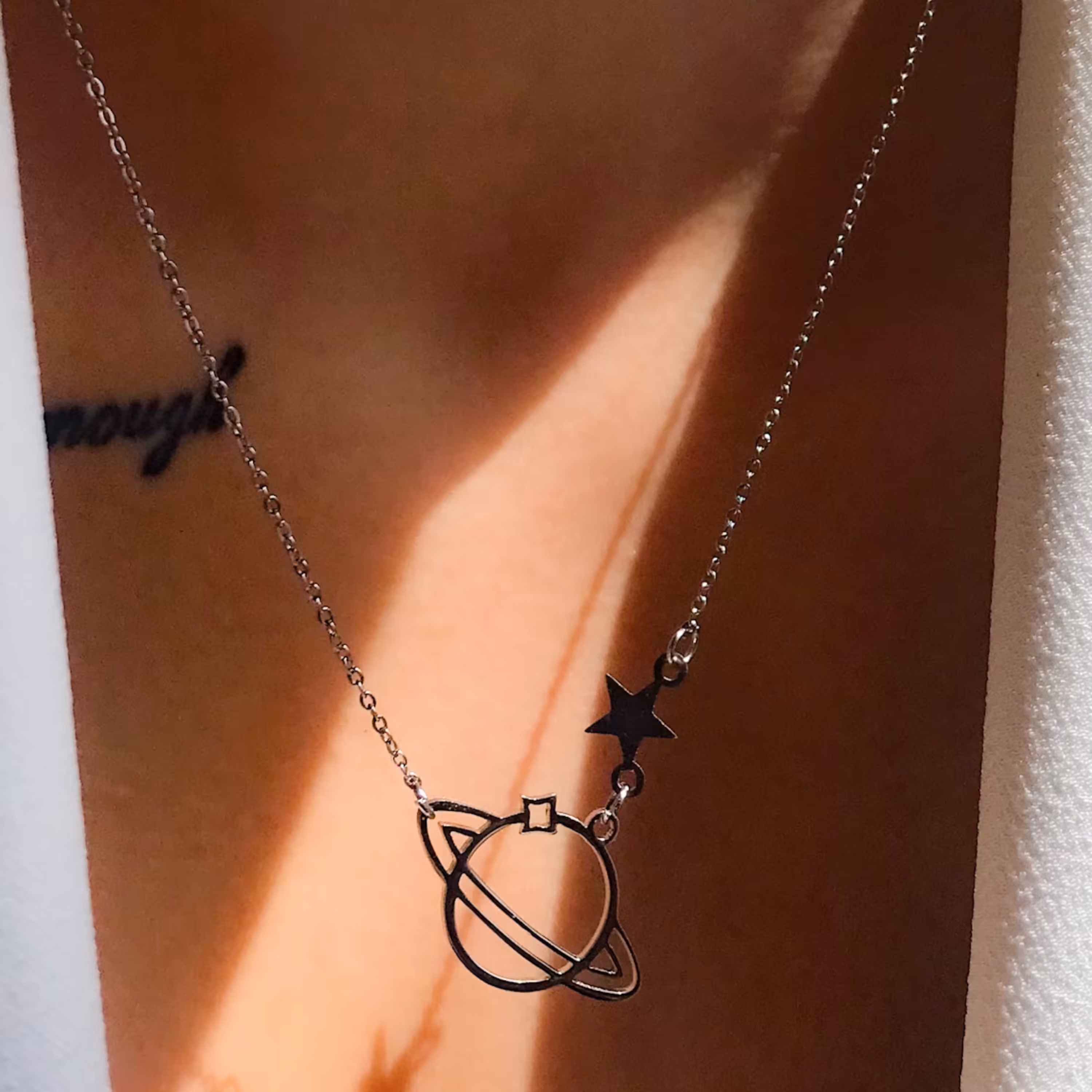 گردنبند زحل و ستاره(استیل رنگ ثابت)