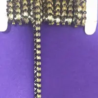 نوار نگیندار باریک مشکی طلایی 1 متر