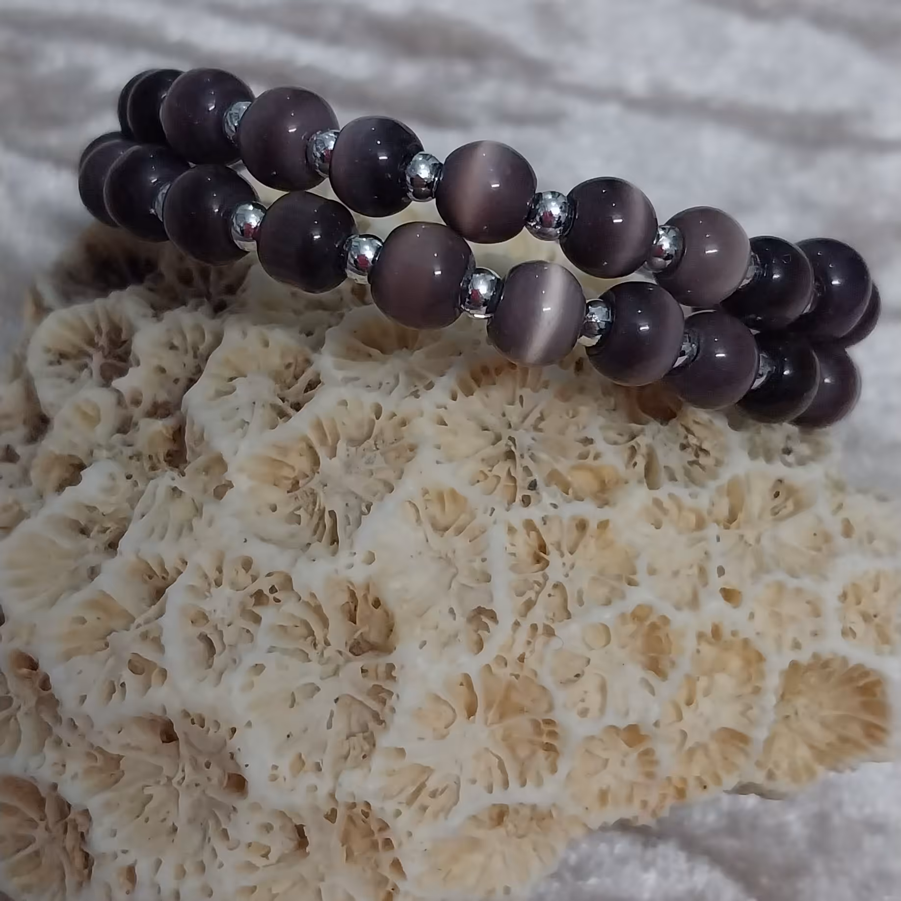 دستبند فنری چشم گربه بنفش شیک و زیبا