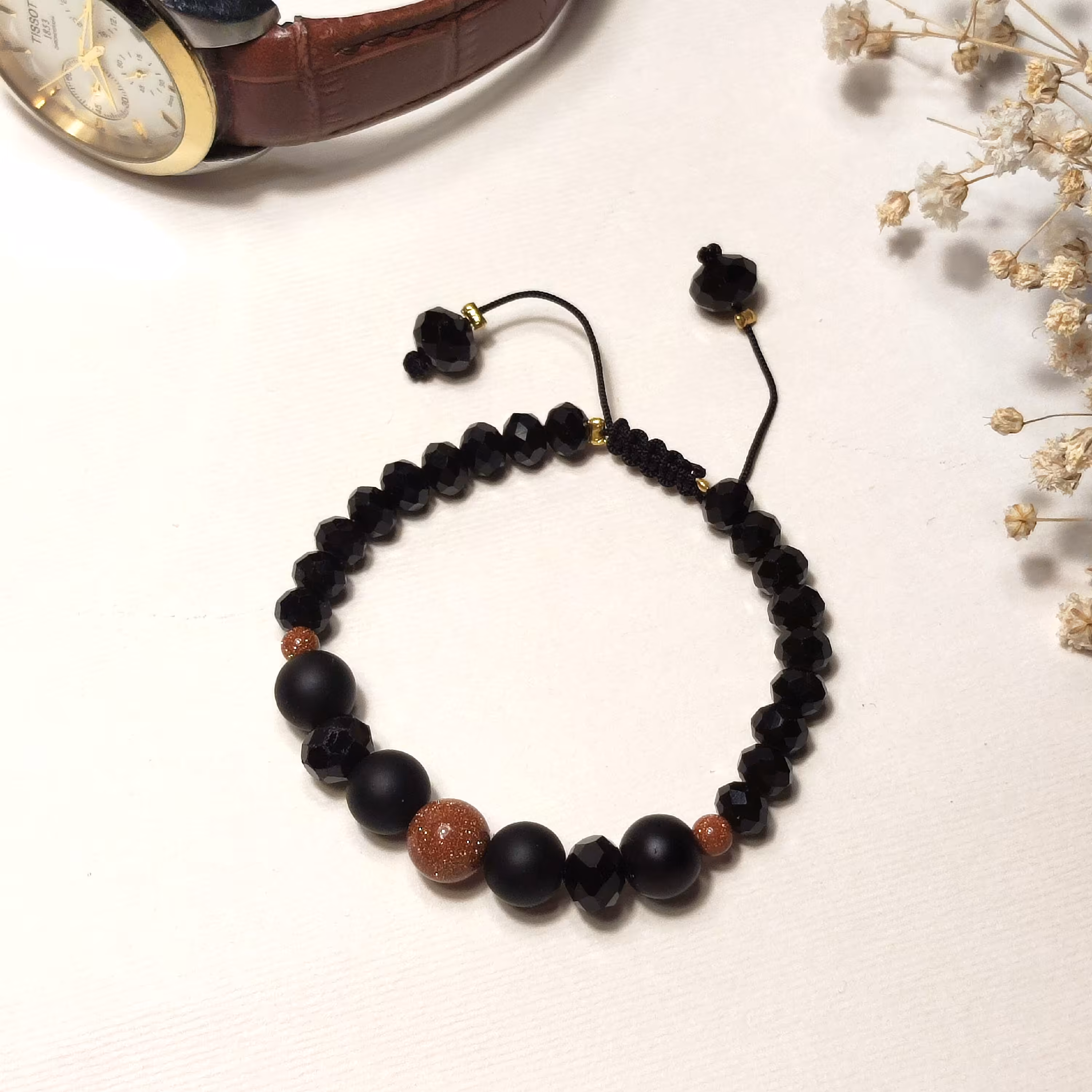 دستبند دل ربا به همراه مهره کریستال مشکی