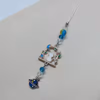 آویز موبایل ، آویز کیف ، آویز باکس ایرپاد و ... گربه و زحل آبی