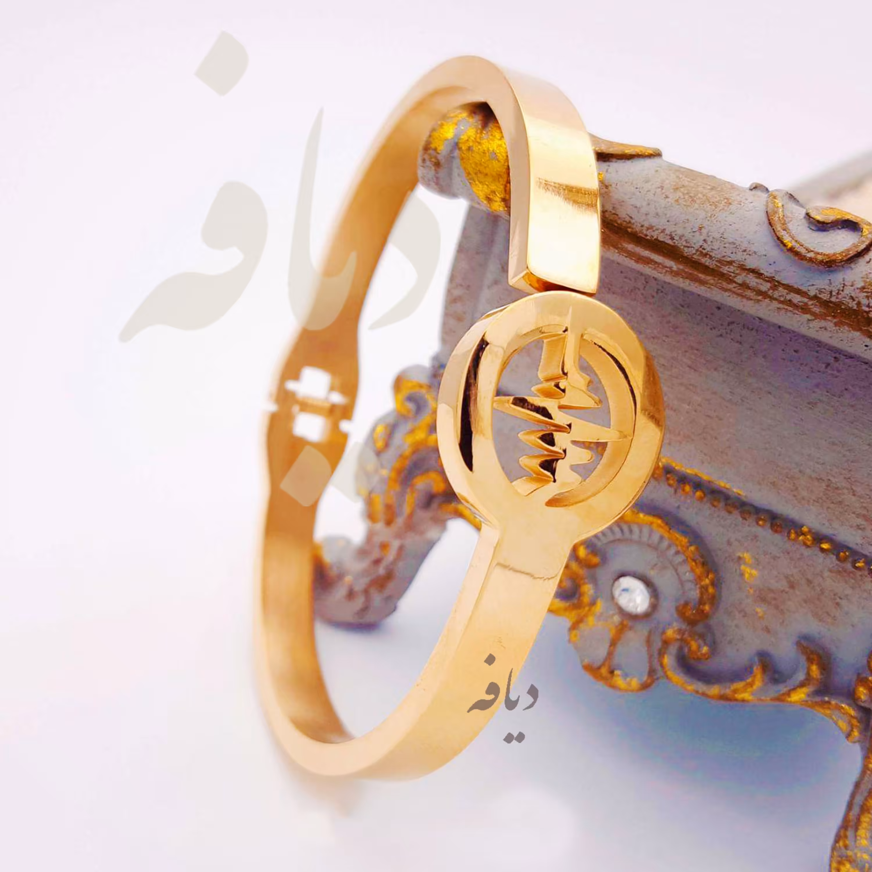 دستبند النگویی قفلی طرح ضربان استیل طلایی رنگ ثابت