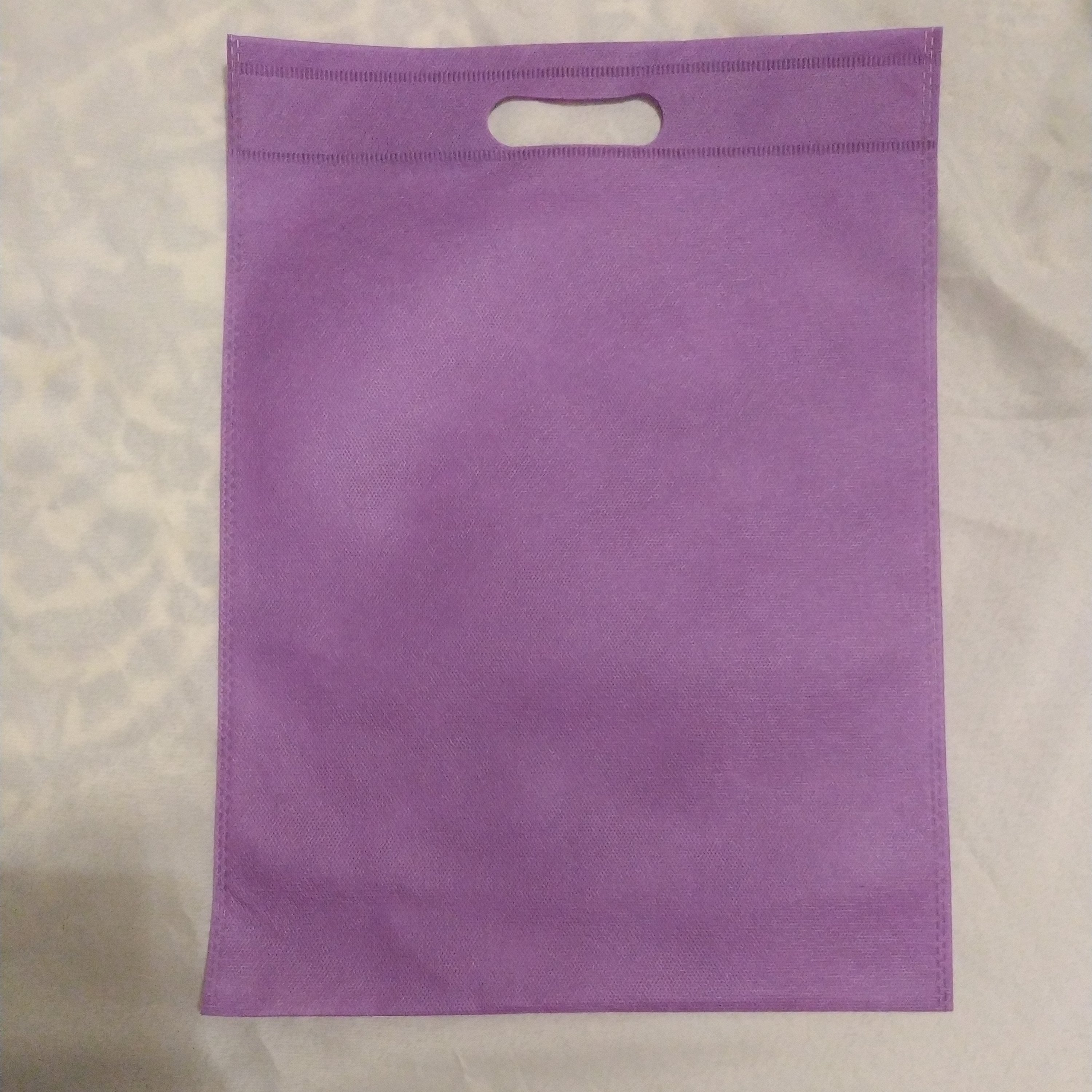 بسته 50عددی ساک دستی سوزنی 30*40 دسته پانچ 60گرم رنگ یاسی