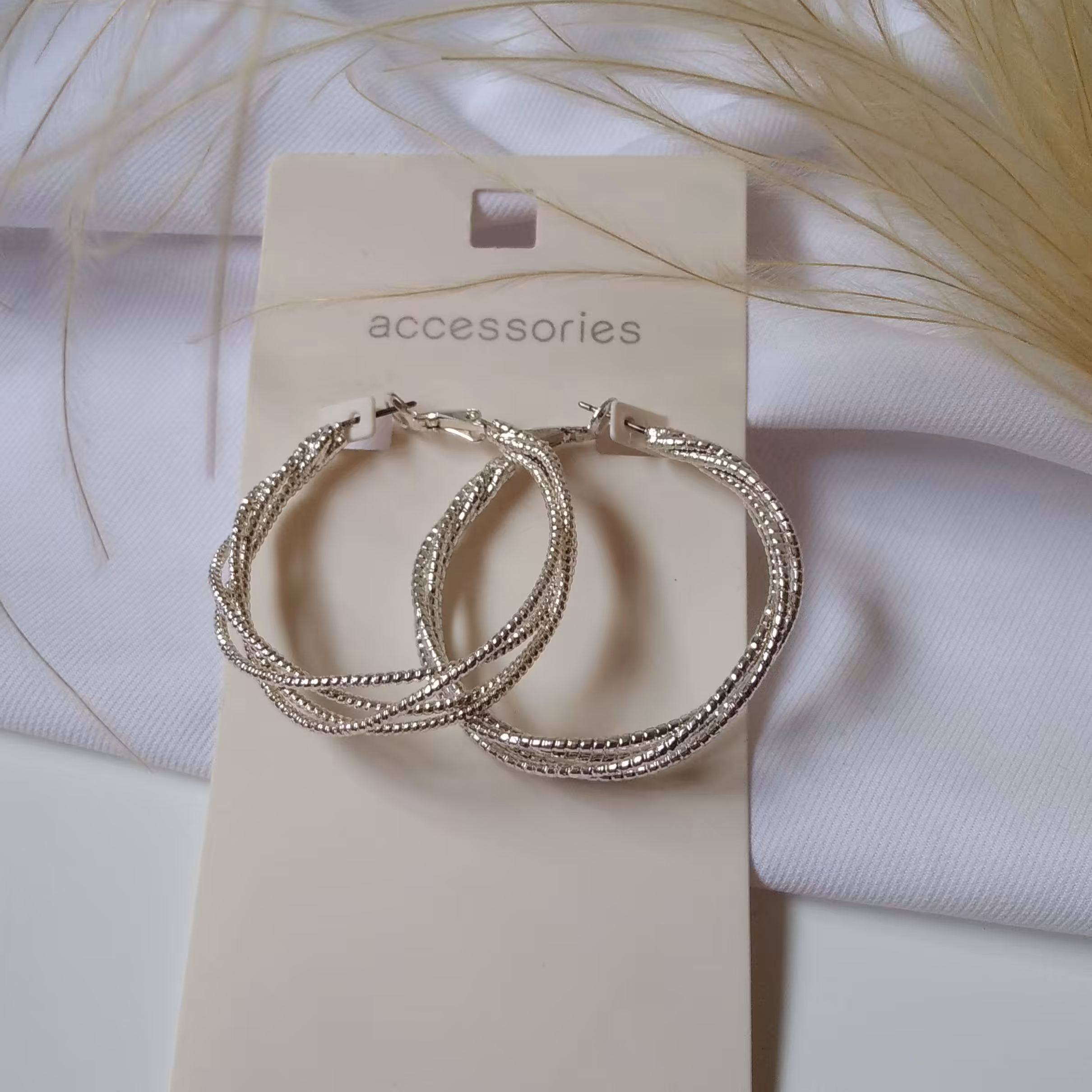 گوشواره حلقه ای فلزی، چند حلقه پیچ خورده، نقره ای رنگ و ضد حساسیت