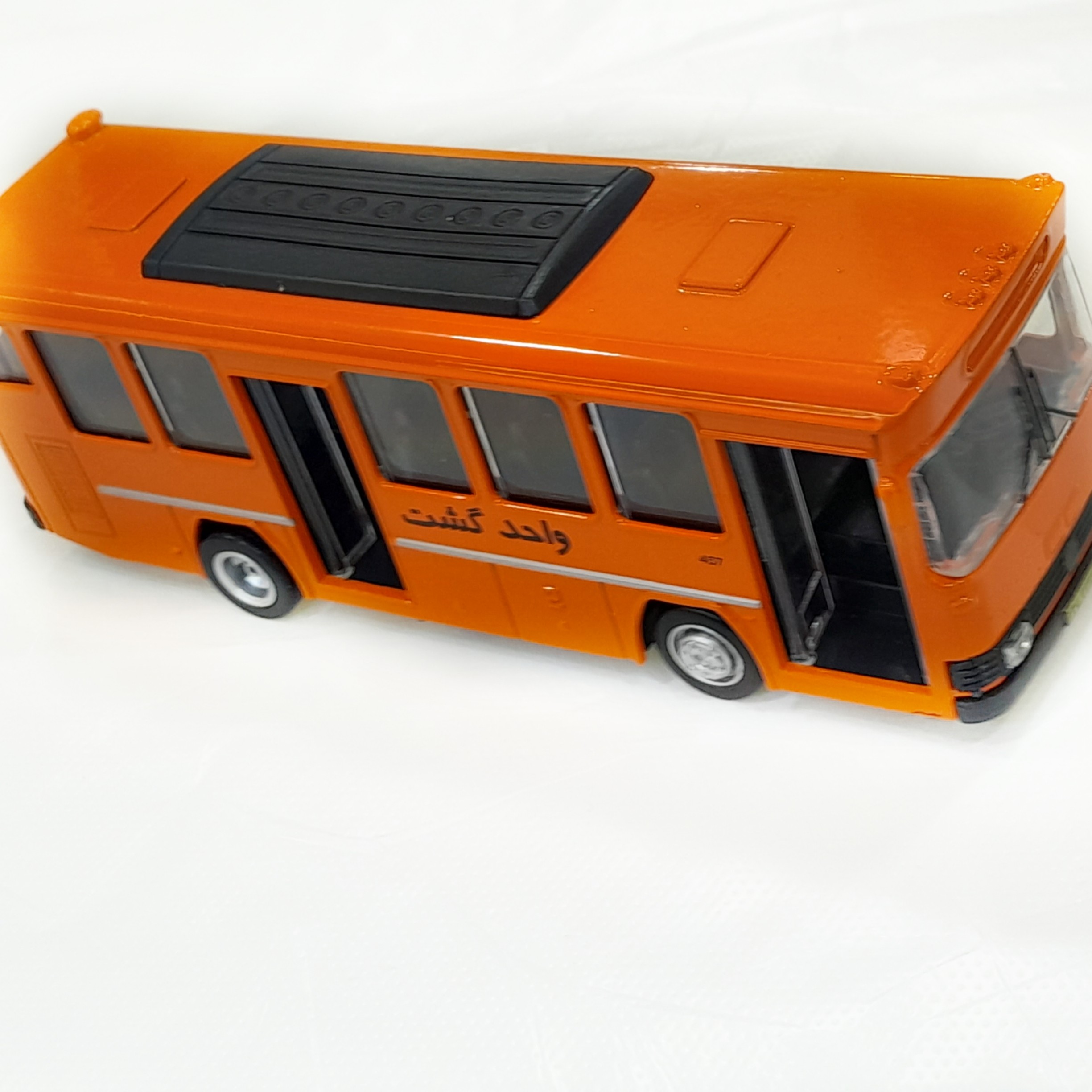 اتوبوس فلزی بنزشرکت واحدنارنجی موزیکال و چراغدار خارجی