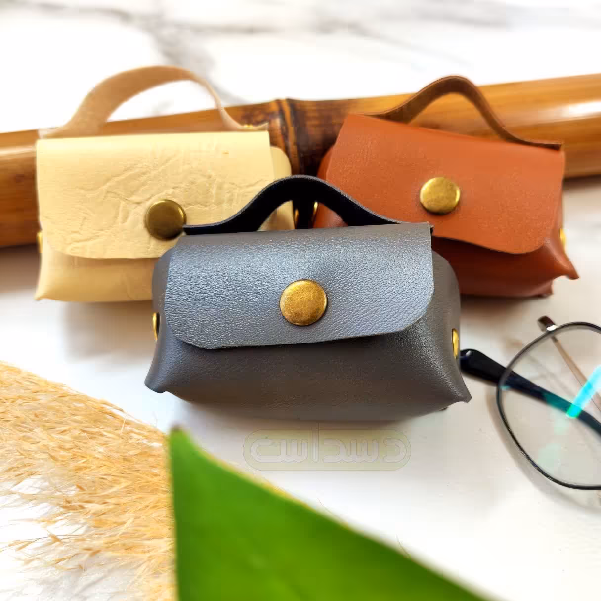 جا هندزفری چرمی جا فلشی جا کلیدی جا زیورآلات آویز کیف