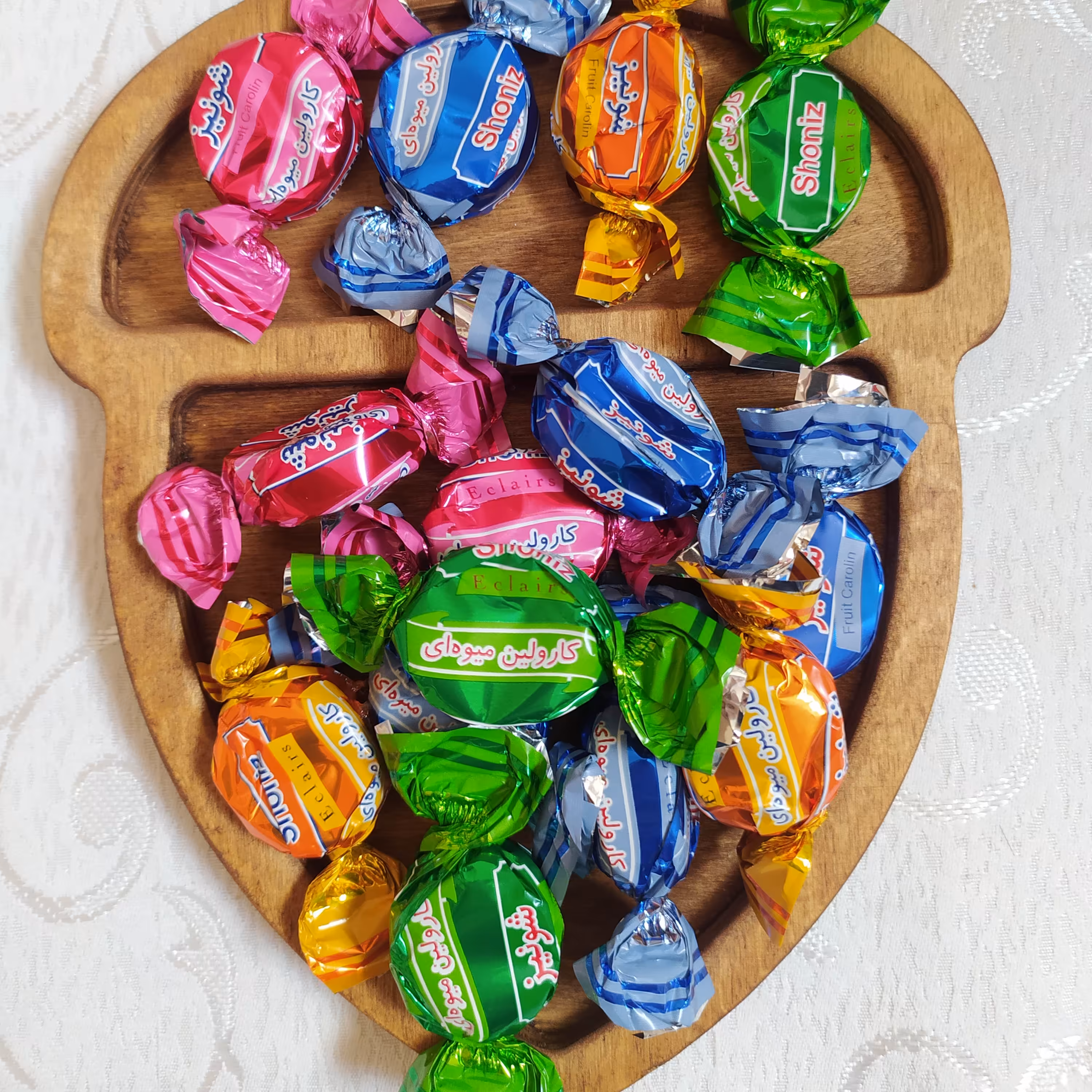 شکلات کارولین میوه ای روکش کاکائویی مغز میوه ای شونیز بسته 500گرمی 
