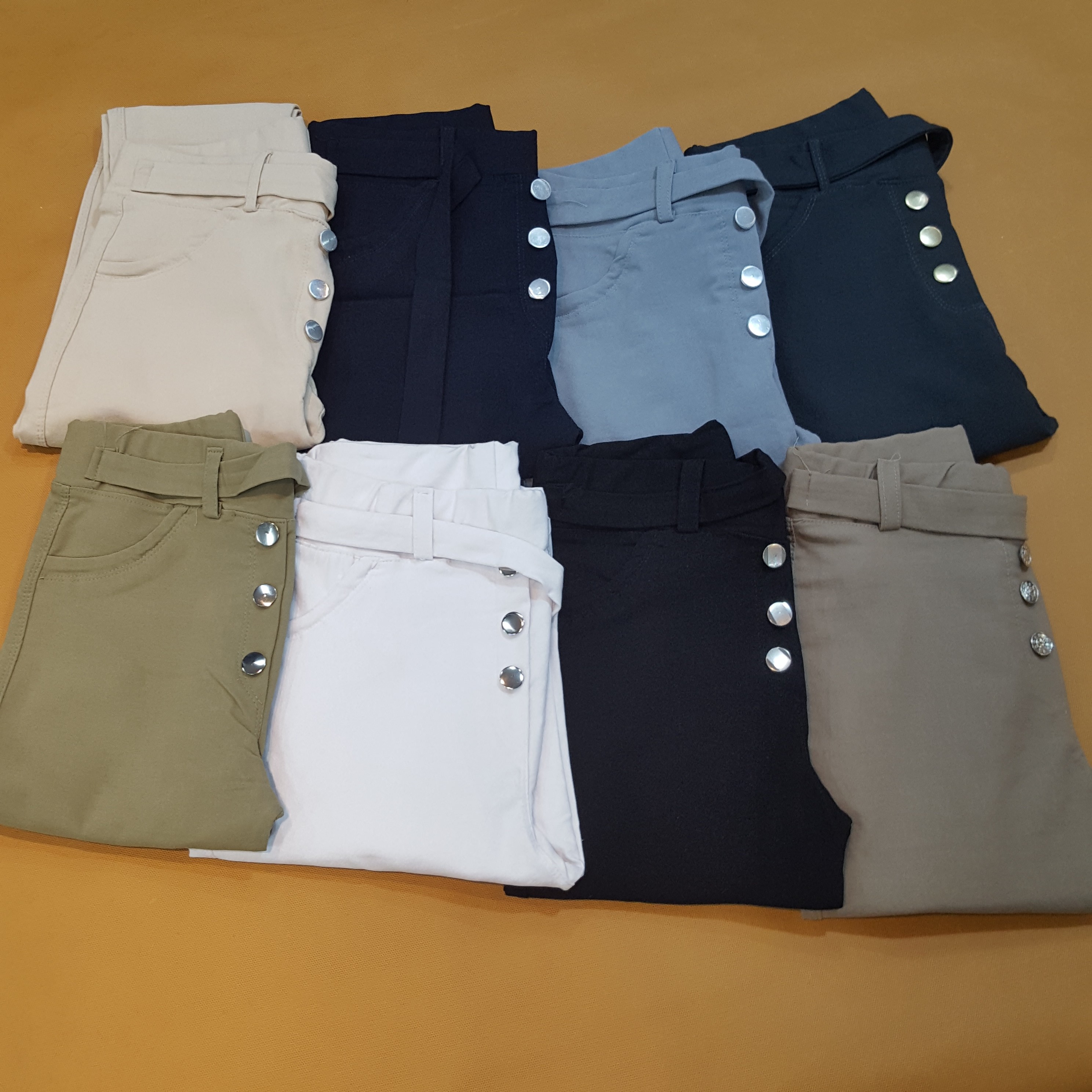 شلوار زنانه جذب کمر کش 7 رنگ جذاب سایز 38تا48 دمپا لول داری دکمه تزئینی جنس کتان بنگال فول کش